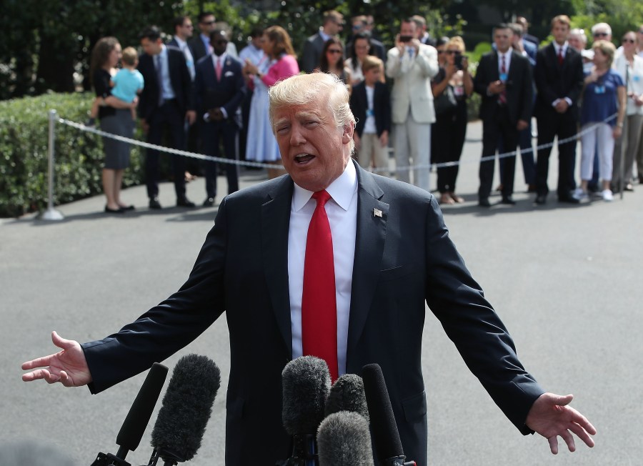 Donald Trump speaks to the media at the White House before departing on Marine One to New York on Aug. 17, 2018. (Credit: Mark Wilson/Getty Images)