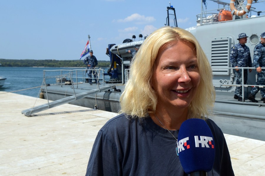 British tourist Kay Longstaff speaks to the press upon her arrival in Pula with the Croatias coast guard ship, on August 19, 2018, which saved her after falling off a cruise ship near Croatian coast. (Credit: STR/AFP/Getty Images).