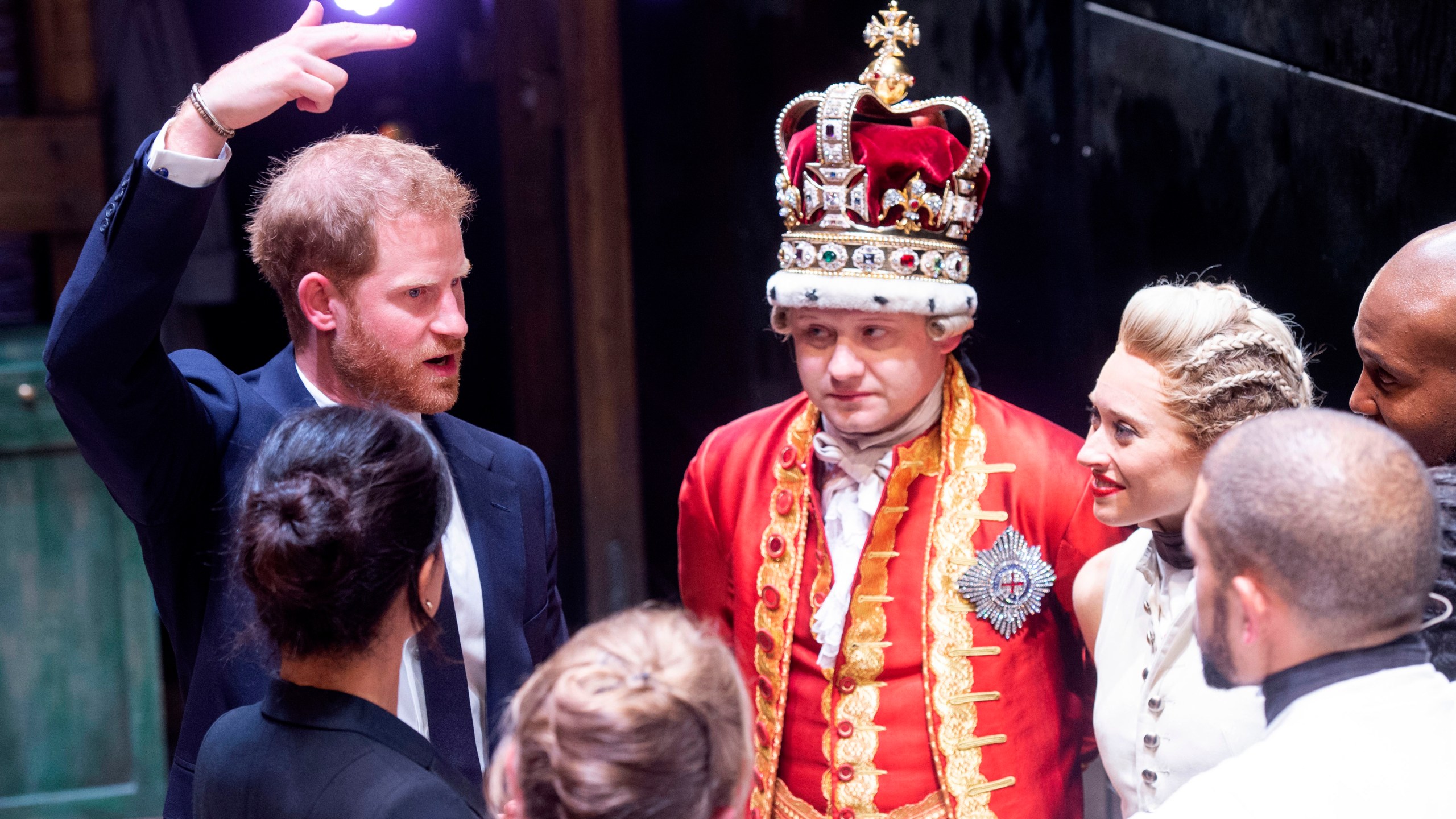 Meghan, Duchess of Sussex (L) and Prince Harry, Duke of Sussex meet the cast and crew of 'Hamilton' backstage after the gala performance in support of Sentebale at Victoria Palace Theatre on August 29, 2018 in London, England. (Credit: WPA Pool/Getty Images)