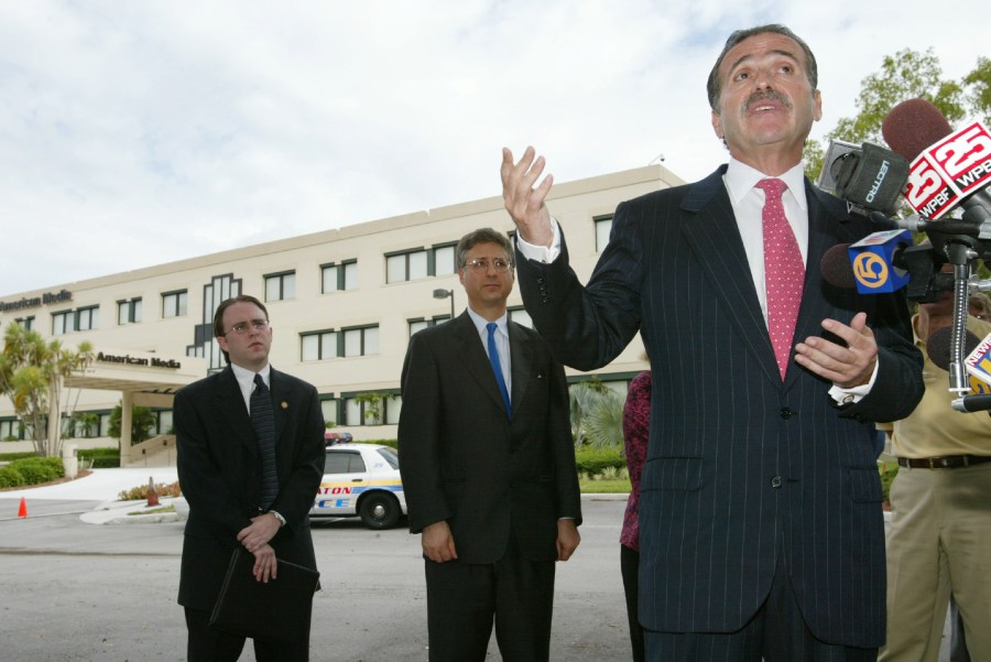 David Pecker, the CEO of American Media, speaks to the news media August 16, 2002, in front of the American Media Building in Boca Raton, Fla. (Credit: Joe Raedle/ Getty Images)