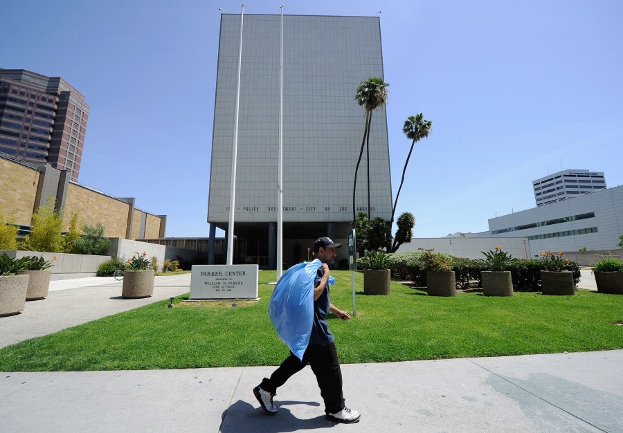 A man walks past the now empty Los Angeles Police Department headquarters, Parker Center, which was one of the flash points of the 1992 L.A. riots, on April 28, 2012. (Credit: Kevork Djansezian / Getty Images)