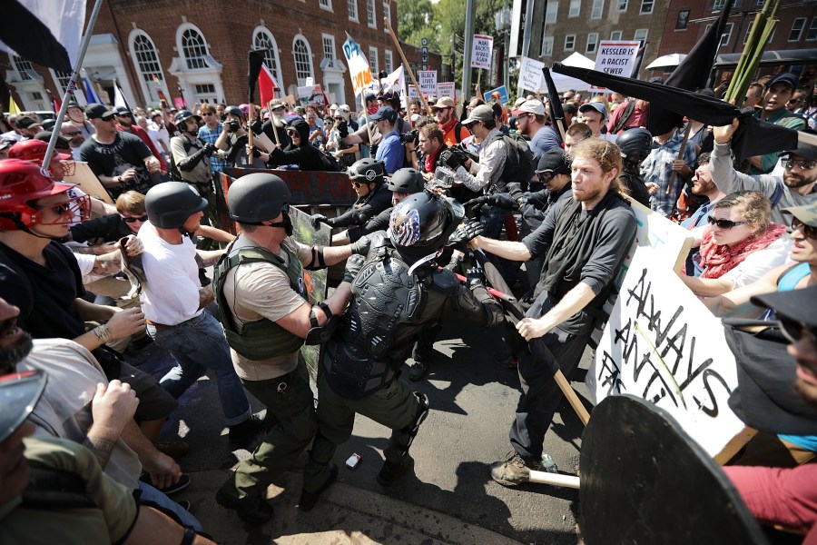 White nationalists, neo-Nazis and members of the "alt-right" clash with counter-protesters as they enter Emancipation Park during the "Unite the Right" rally in Charlottesville, Virginia on Aug. 12, 2017. (Credit: Chip Somodevilla/Getty Images)