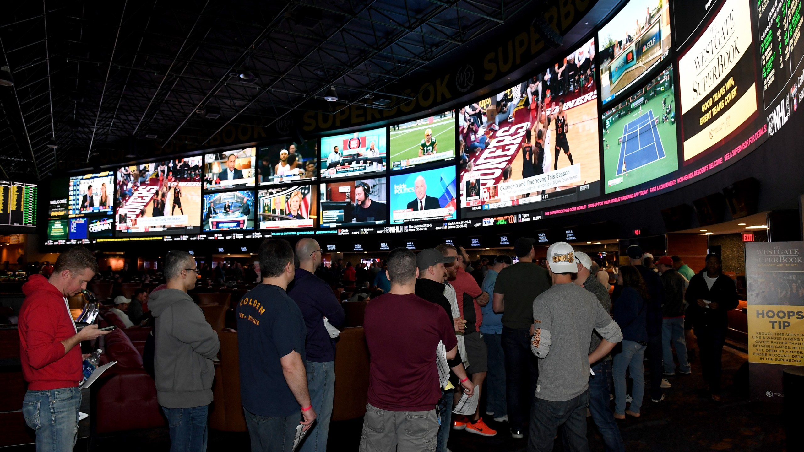 Guests line up to place bets as they attend a viewing party for the NCAA Men's College Basketball Tournament at the Westgate Las Vegas Resort and Casino on March 15, 2018. (Credit: Ethan Miller/Getty Images)