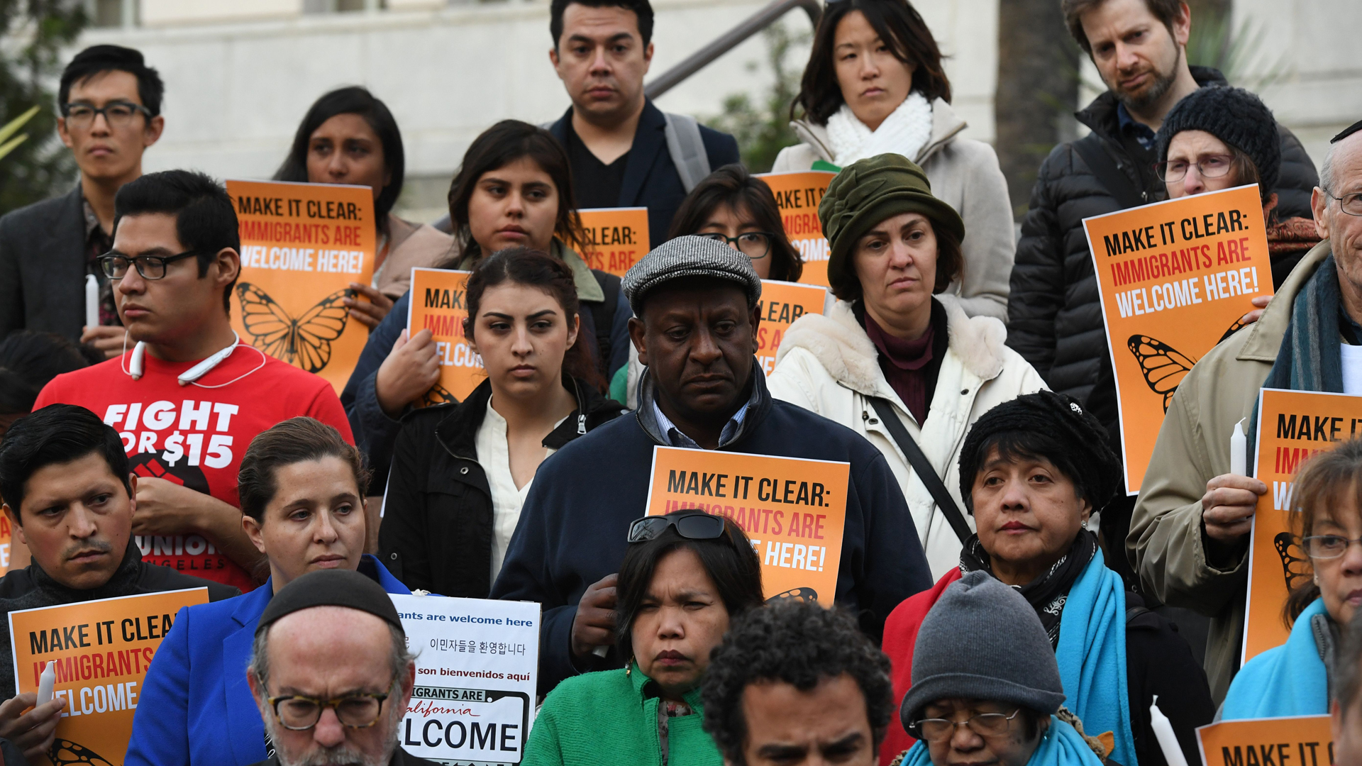 Immigrant rights groups look on during a vigil to protest President Donald Trump's crackdown on “sanctuary cities” outside Los Angeles City Hall on January 25, 2017. (MARK RALSTON/AFP/Getty Images)