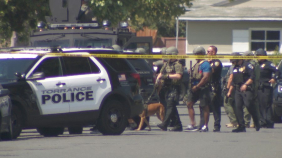 Authorities search for an armed suspect in a Torrance neighborhood on Aug. 27, 2018. (Credit: KTLA)