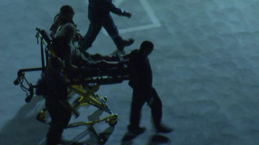 A man is taken into the Henry Mayo Newhall Hospital after being airlifted from a mountainside in the Angeles National Forest on Sept. 17, 2018. (Credit: KTLA)