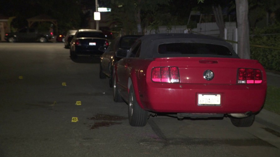 Evidence markers sit at the scene of a shooting that left four people wounded during a house party in Baldwin Park on Sept. 23, 2018.