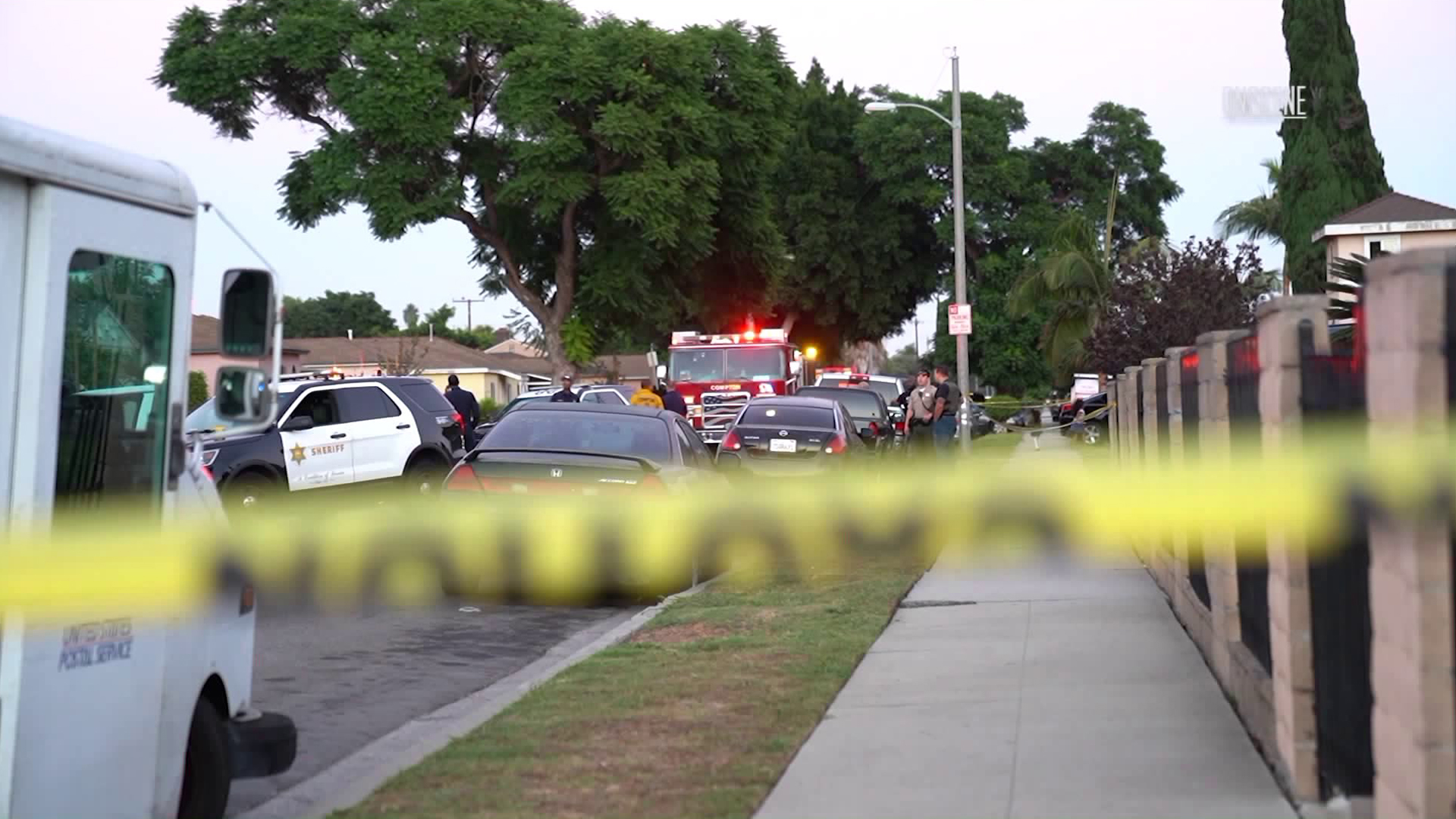 Officials investigate the scene where a man and teen were killed and a woman was wounded in a shooting at a Compton home on Sept. 28, 2018. (Credit: OnScene.TV)