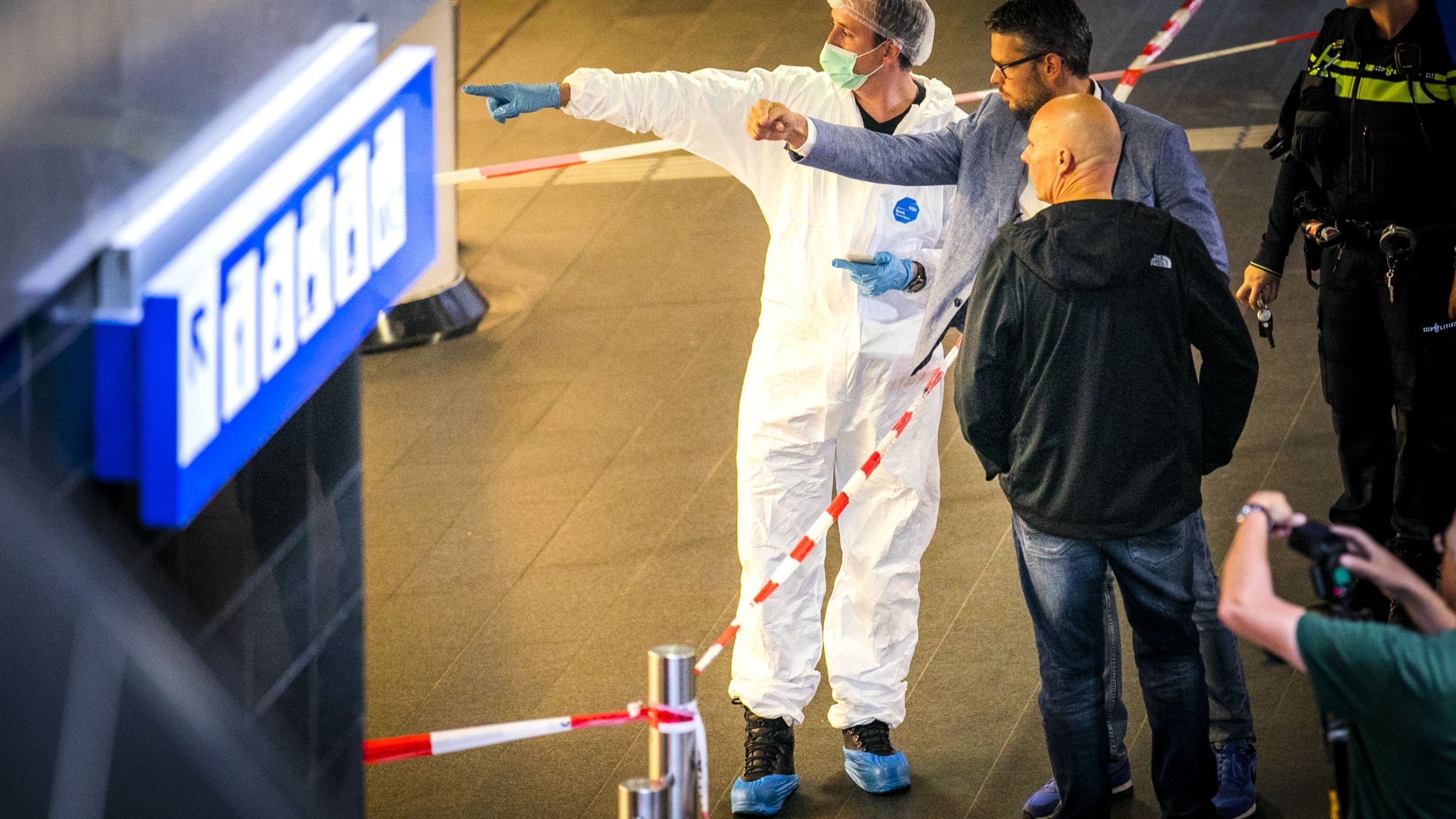 Policemen and forensics are at work after a stabbing incident at the central station in Amsterdam on Aug. 31, 2018. (Credit: REMKO DE WAAL/AFP/Getty Images)