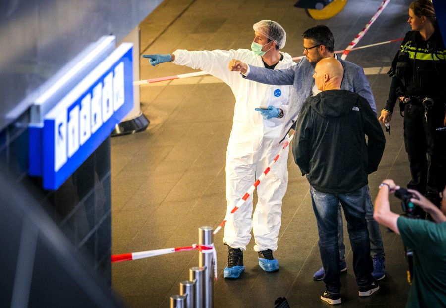 Policemen and forensics are at work after a stabbing incident at the central station in Amsterdam on Aug. 31, 2018. (Credit: REMKO DE WAAL/AFP/Getty Images)