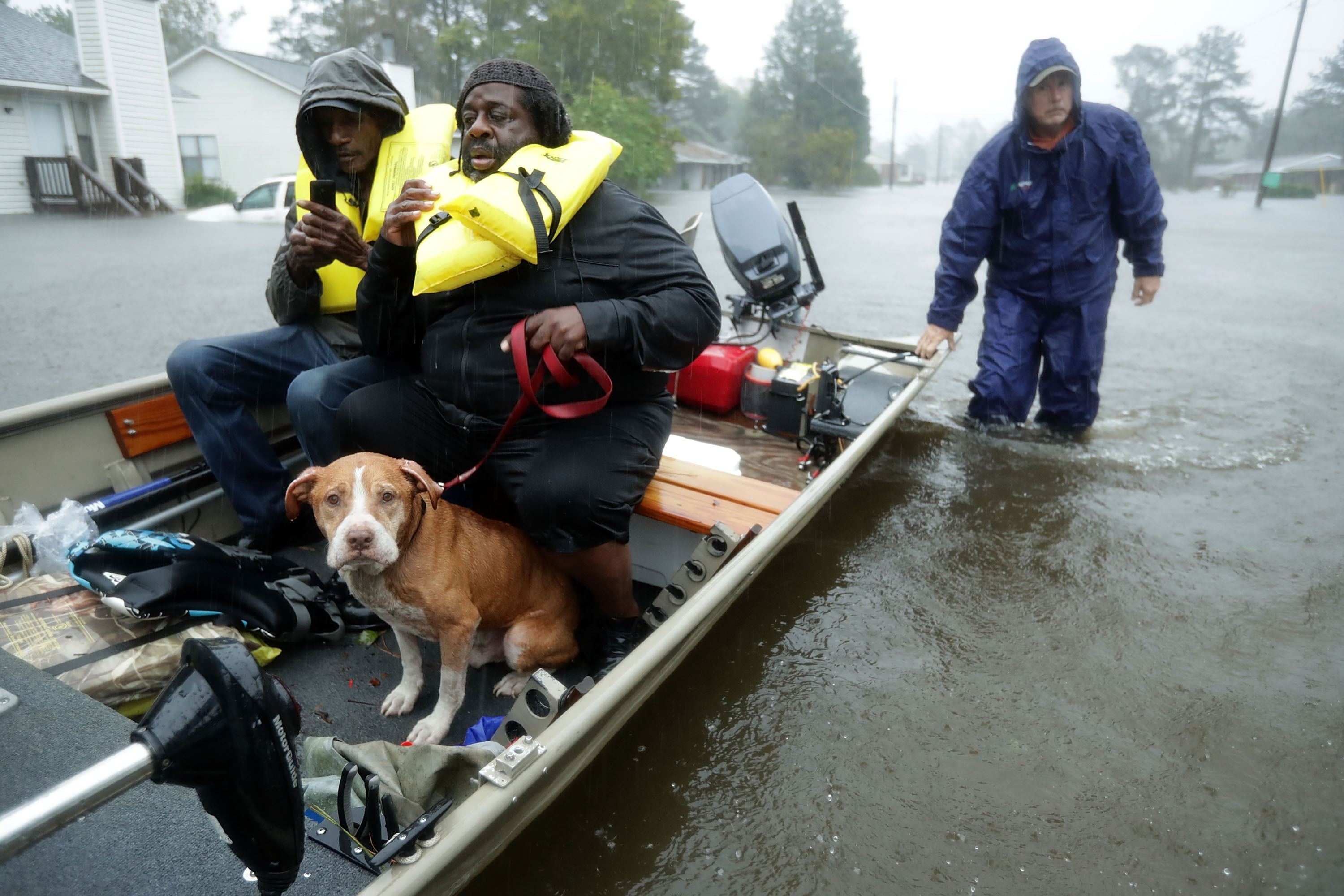 Volunteers from all over North Carolina help rescue residents and their pets from their flooded homes during Hurricane Florence on Sept. 14, 2018 in New Bern. (Credit: Chip Somodevilla/Getty Images)