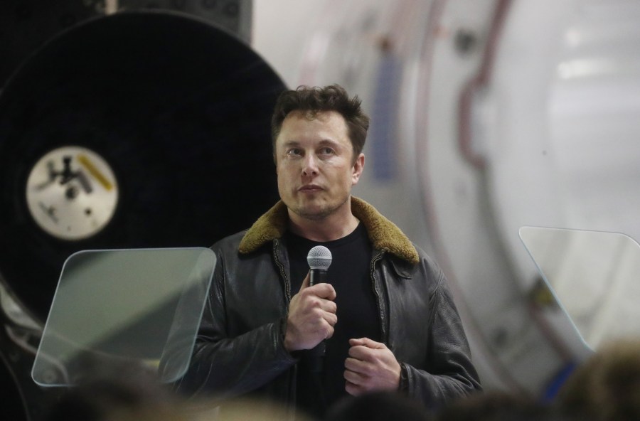 SpaceX CEO Elon Musk speaks at a press conference at company's Hawthorne headquarters, where he announced the Japanese billionaire chosen by the company to fly around the moon, on Sept. 17, 2018. (Credit: Mario Tama / Getty Images)