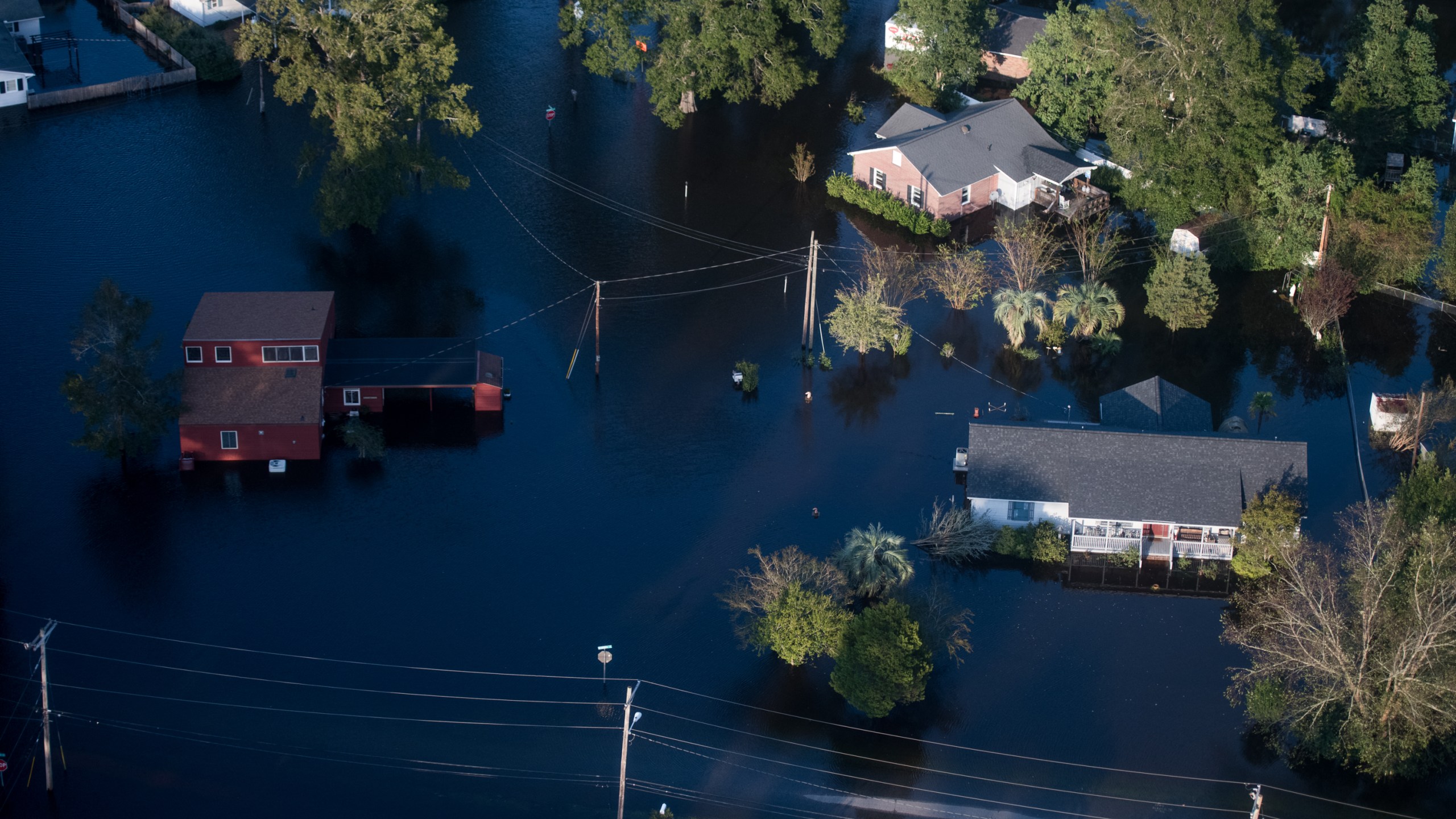 Homes are surrounded by floodwaters from Hurricane Florence on Sept. 17, 2018 in Conway, South Carolina. (Credit: Sean Rayford/Getty Images)