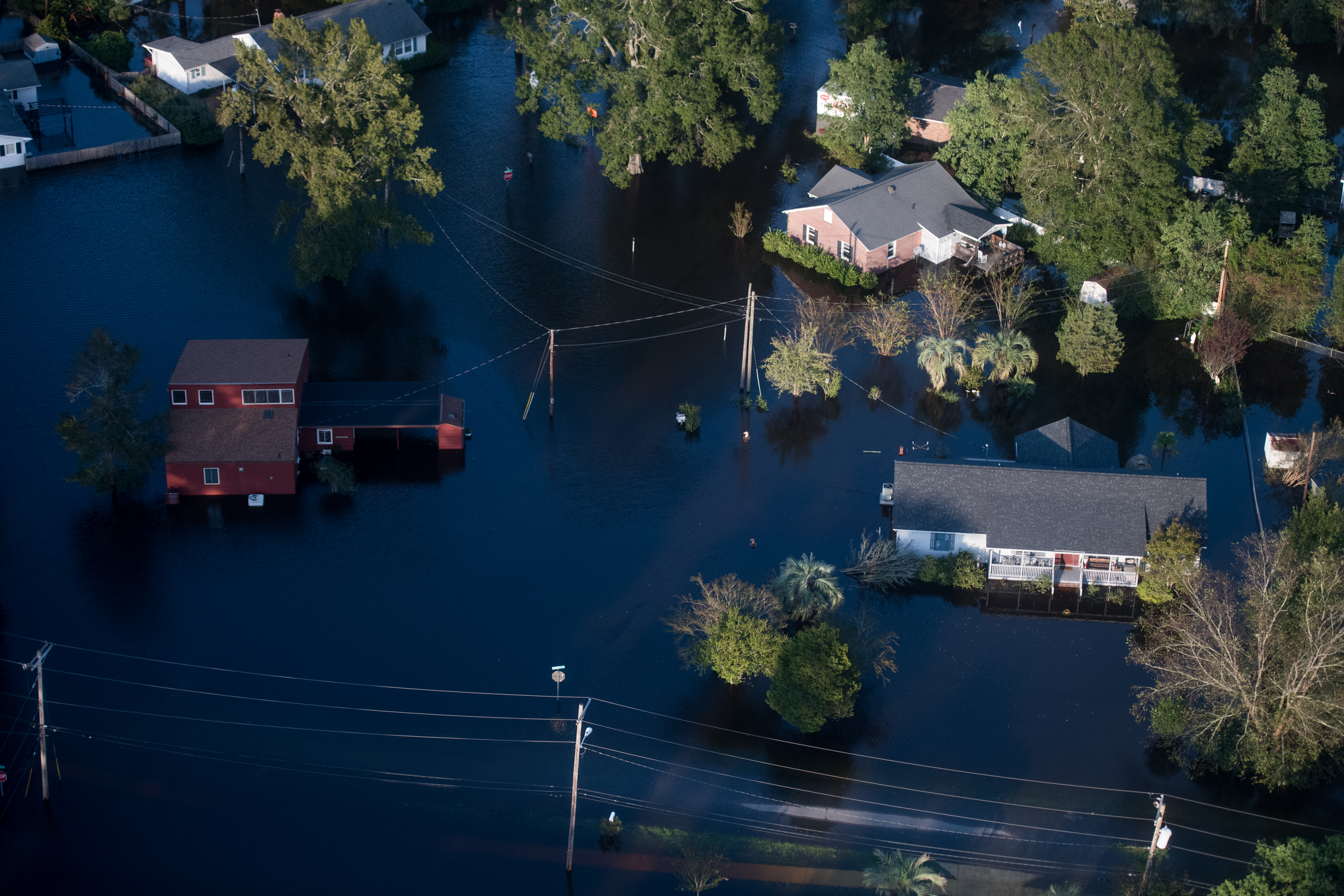 Homes are surrounded by floodwaters from Hurricane Florence on Sept. 17, 2018 in Conway, South Carolina. (Credit: Sean Rayford/Getty Images)