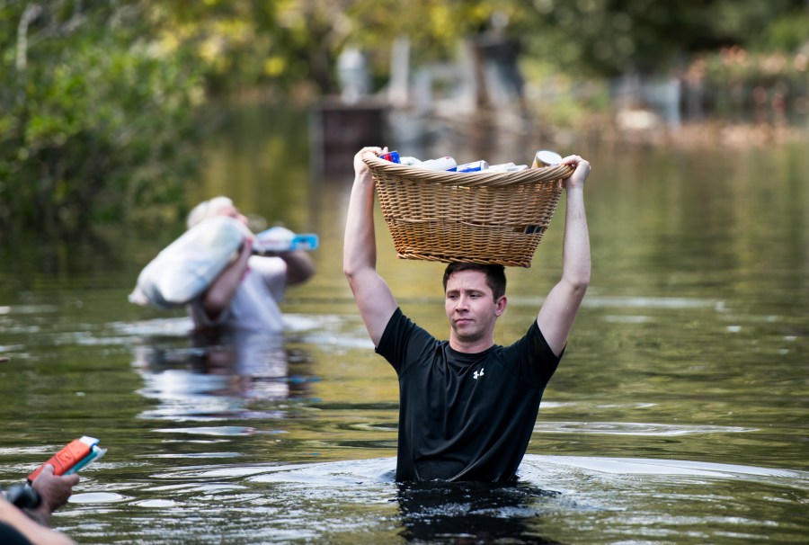 Codey Lamb walks through floodwaters caused by Hurricane Florence on Sept. 20, 2018 in Longs, South Carolina. (Credit: Sean Rayford/Getty Images)