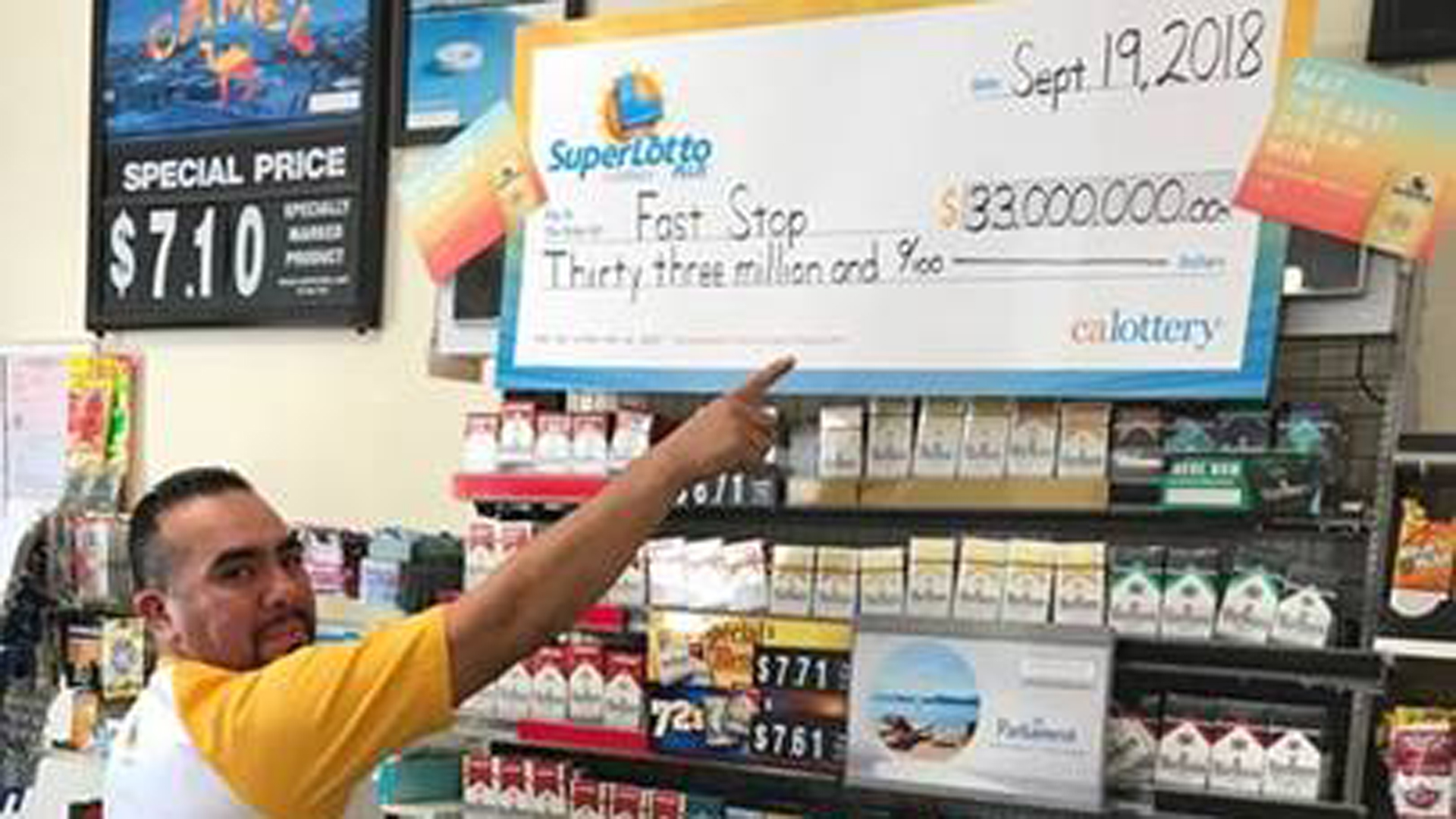 Fast Stop Manager Luis Marron is shown after a winning ticket was sold at his store in Lake View Terrace. (Credit: California Lottery)