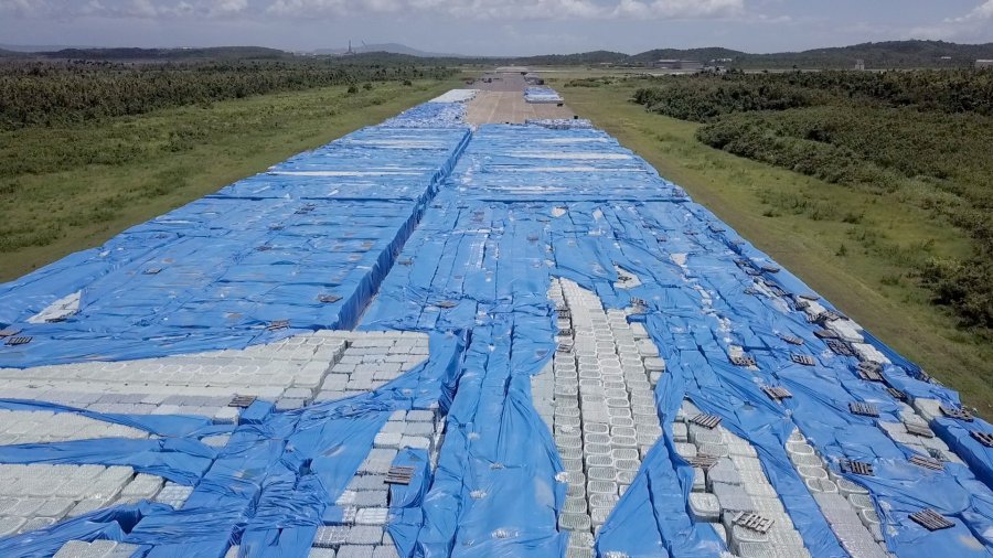 Stacks upon stacks of bottled water sit near a runway in Ceiba, Puerto Rico, on September 12, 2018. (Credit: Julian Quinones/CNN)