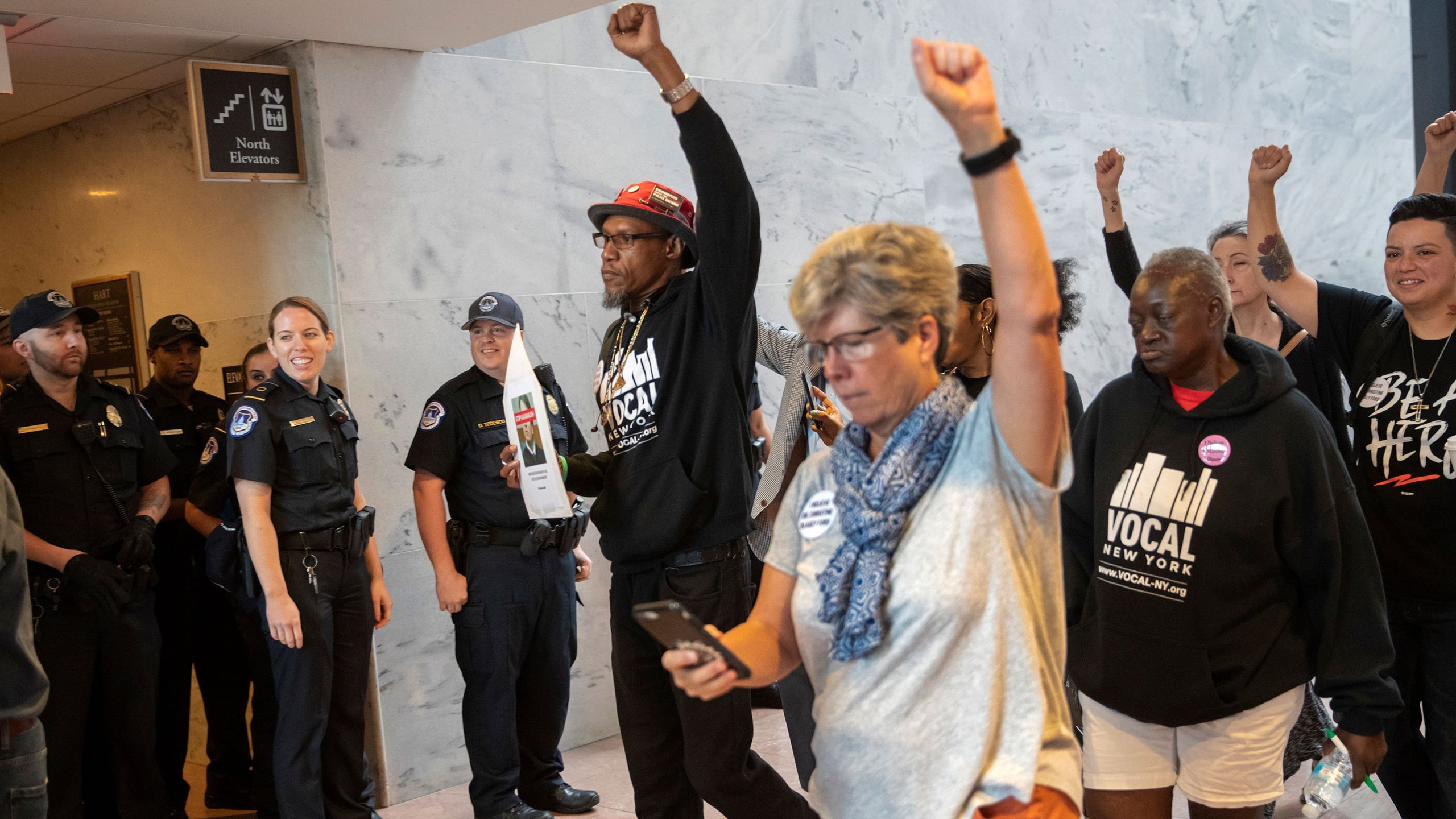 Protesters opposed to the confirmation of Brett Kavanaugh to the Supreme Court targeted the offices of swing vote Republican senators on Sept. 20, 2018, to pressure them to vote against President Donald Trump's nominee, who is denying allegations he sexually assaulted a woman when they were both in high school in the 1980s. (Credit: J. Scott Applewhite/AP via CNN)