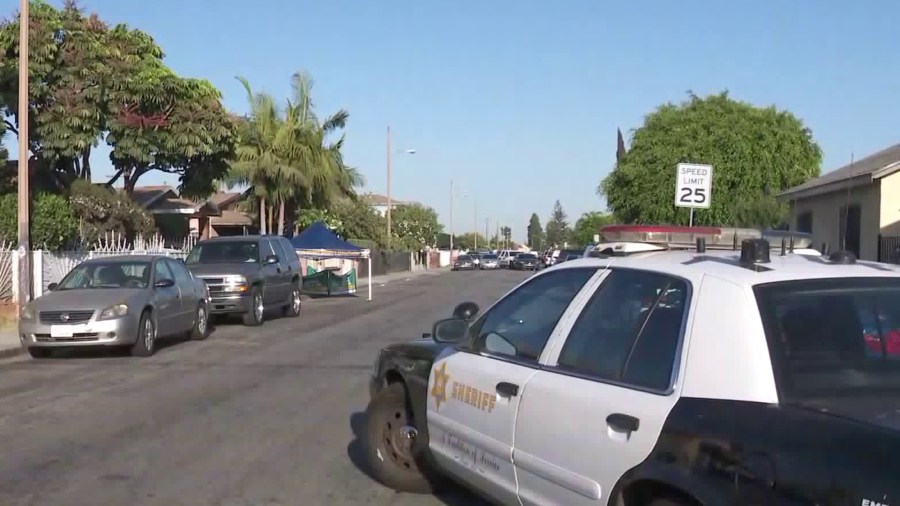 Authorities respond to the scene of a fatal shooting in Walnut Park on Sept. 10, 2018. (Credit: KTLA)