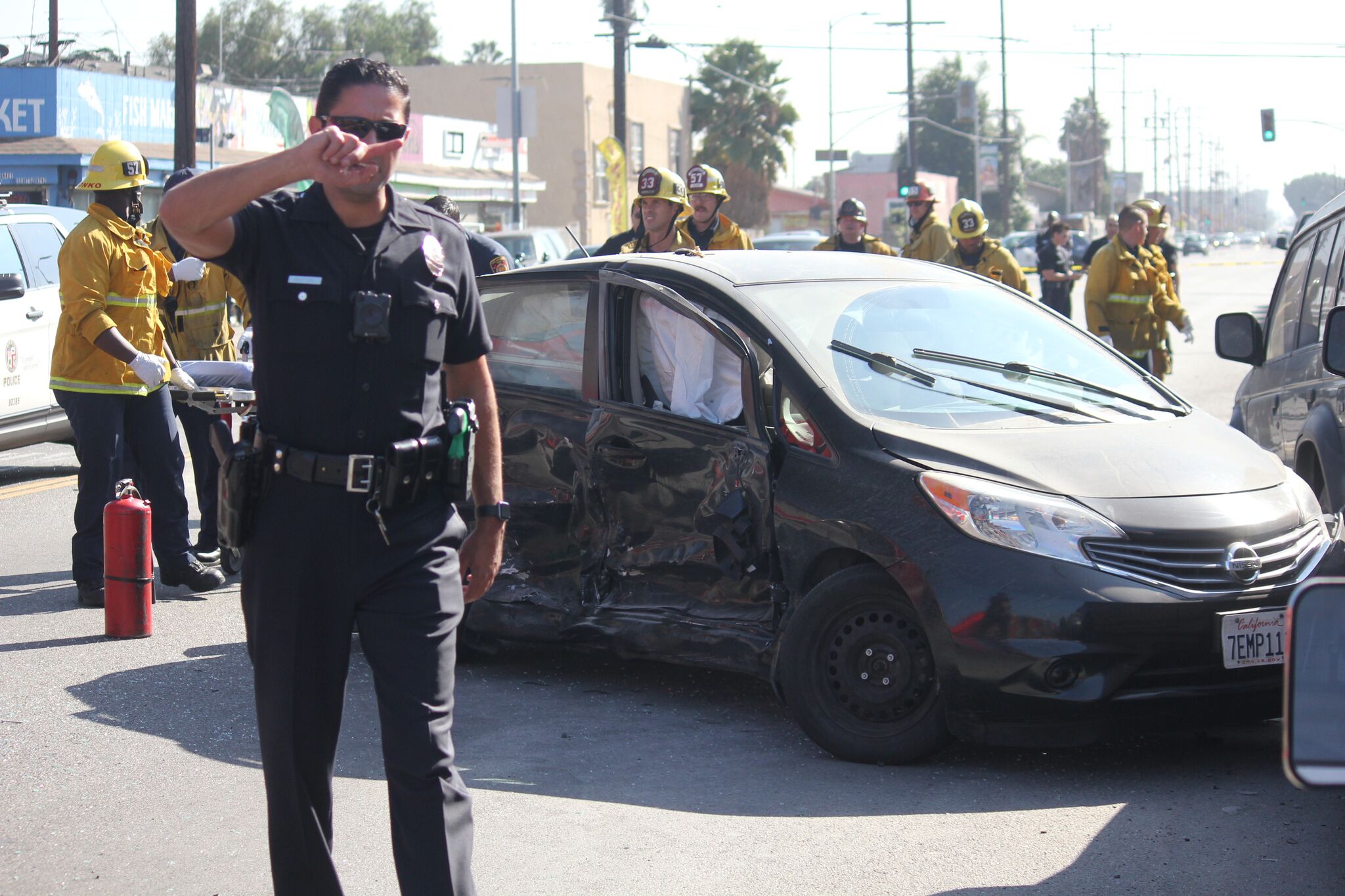 LAPD and LAFD respond to a crash in Vermont-Slauson on Oct. 23, 2018. (Credit: Pinkey Gray)