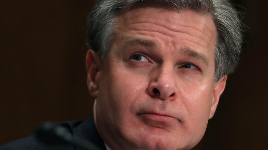 FBI Director Christopher A. Wray listens to comments during a Senate Homeland Security and Governmental Affairs Committee hearing on Capitol Hill, on Oct. 10, 2018. (Credit: Mark Wilson/Getty Images)