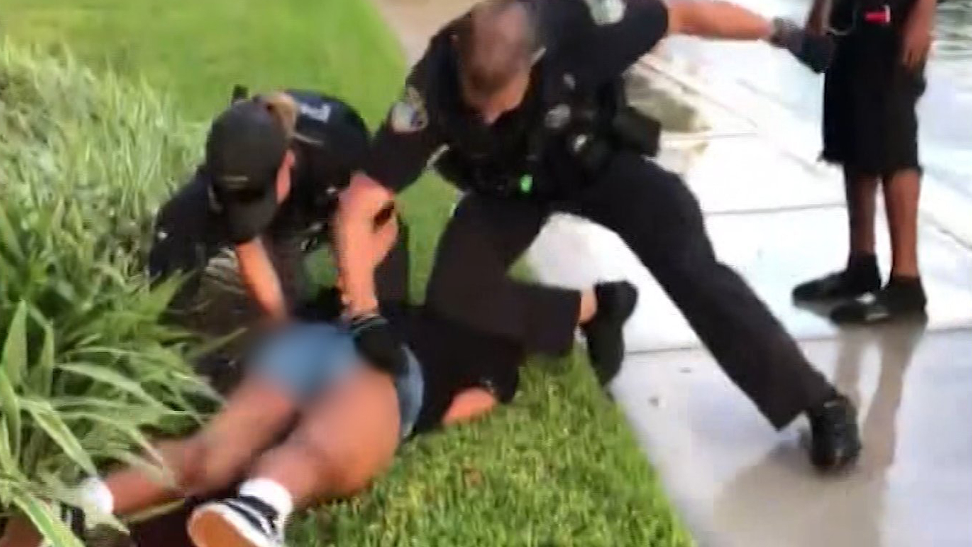 This is a still from a viral video of a police officer hitting a 14-year-old girl during an arrest in Florida. (Credit: WSVN via CNN)