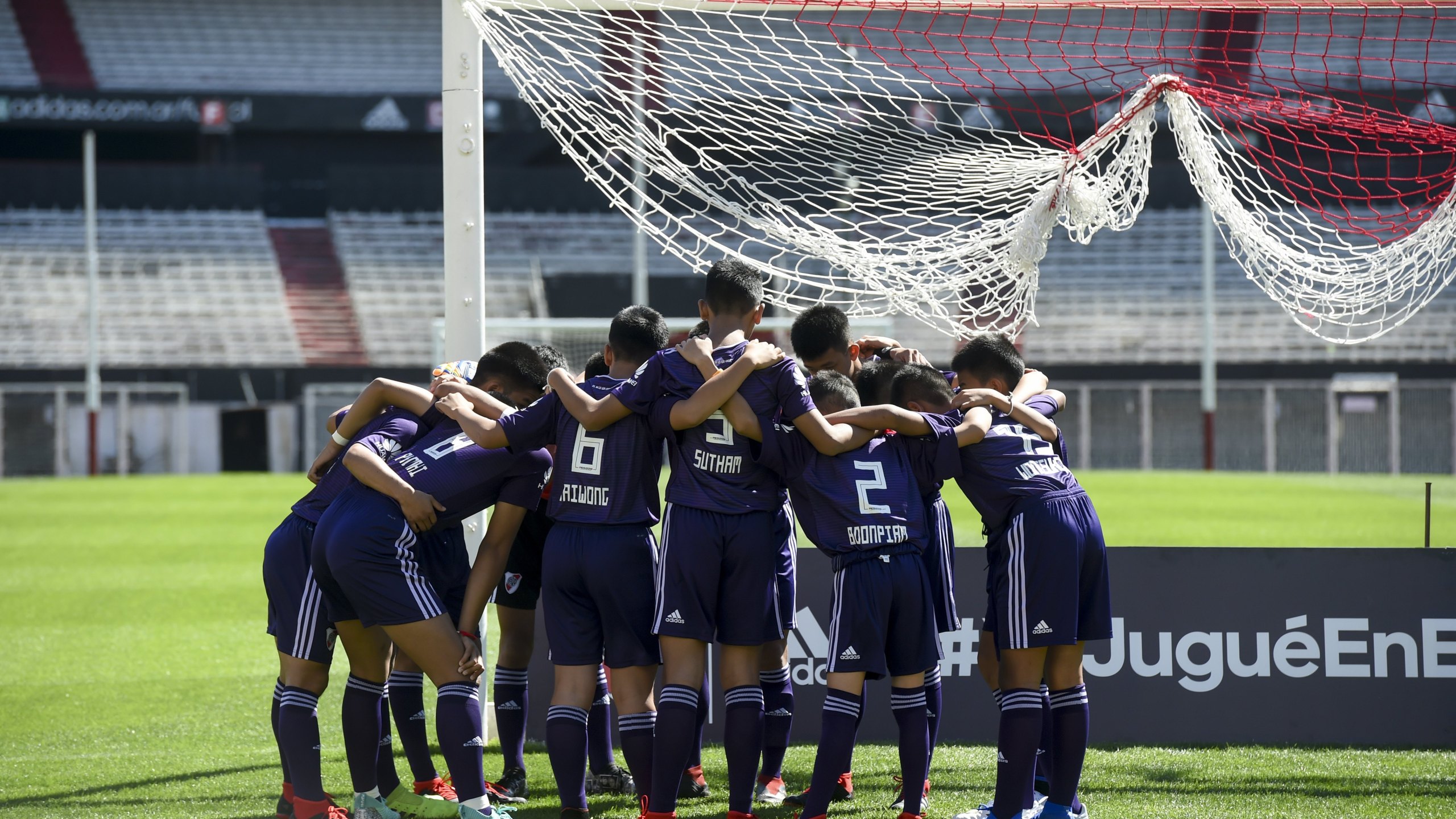 Young footballers of Thai team Wild Boars -who were rescued from the Tham Luang cave in Thailand get ready for a football match against River Plate Youth Team at Monumental stadium, in Buenos Aires on Oct. 7, 2018. (Credit: Eitan Abramovic/POOL /AFP/Getty Images)