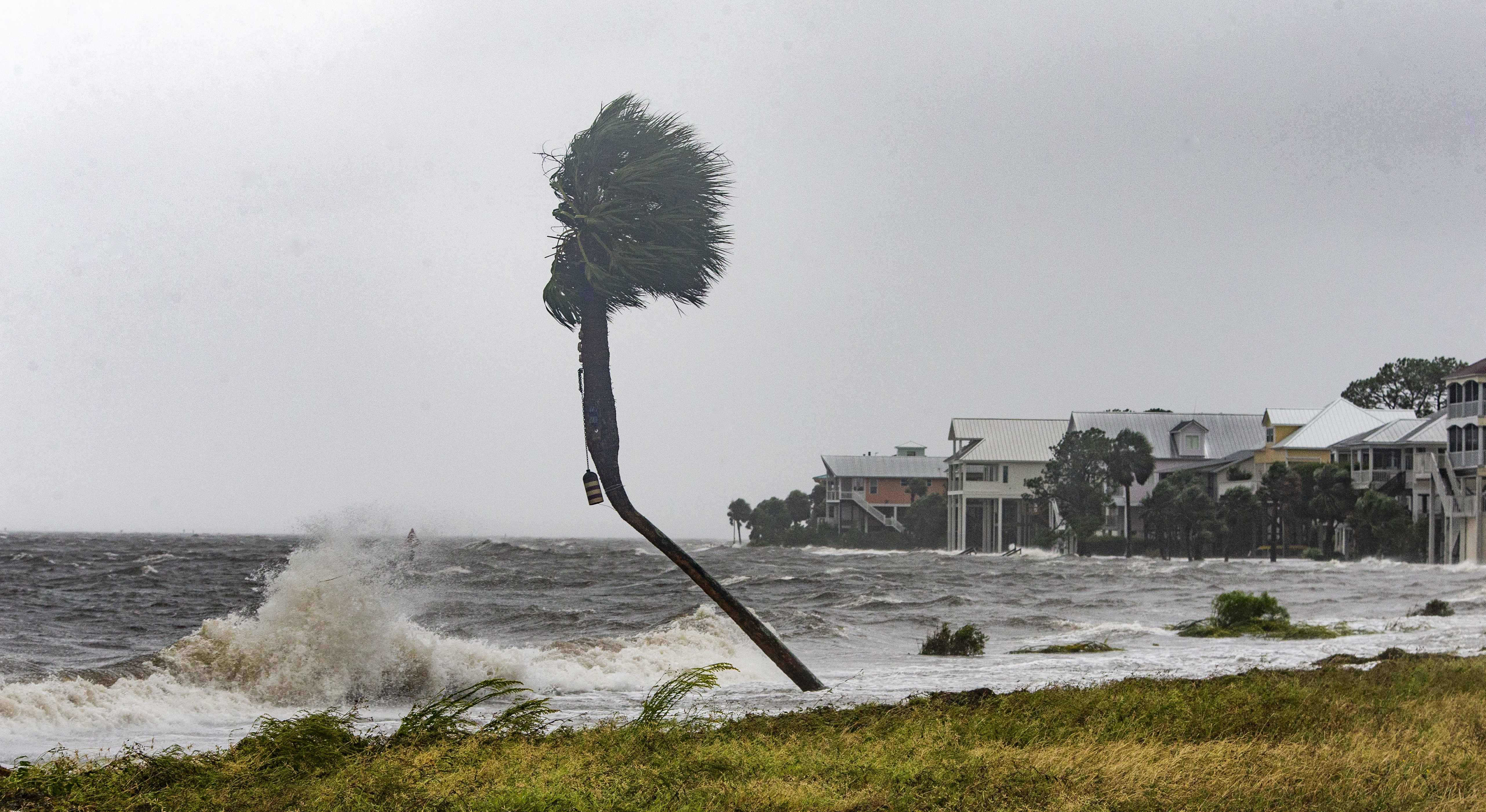 The storm surge and waves from Hurricane Michael batter the beachfront homes on Oct. 10, 2018, in the Florida Panhandle community of Shell Point Beach. (Credit: Mark Wallheiser/Getty Images)