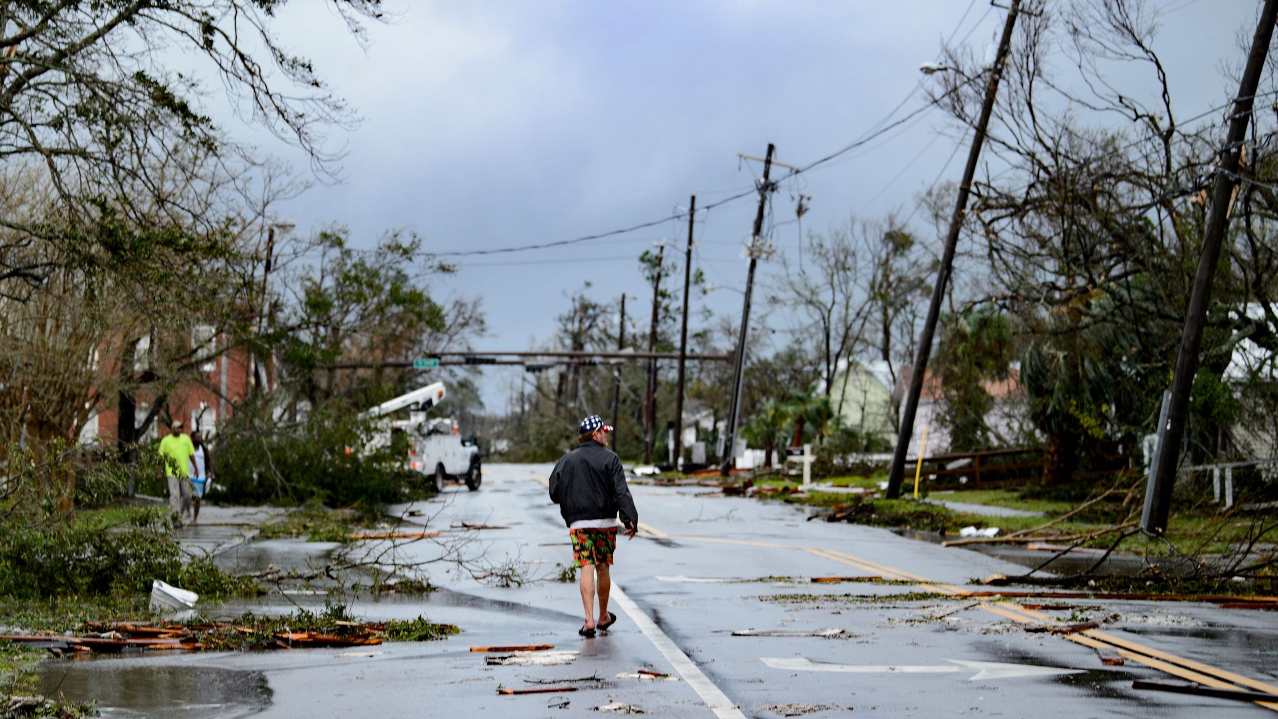 A man walks down the street after Hurricane Michael made landfall on October 10, 2018 in Panama City, Florida. (Credit: BRENDAN SMIALOWSKI/AFP/Getty Images)