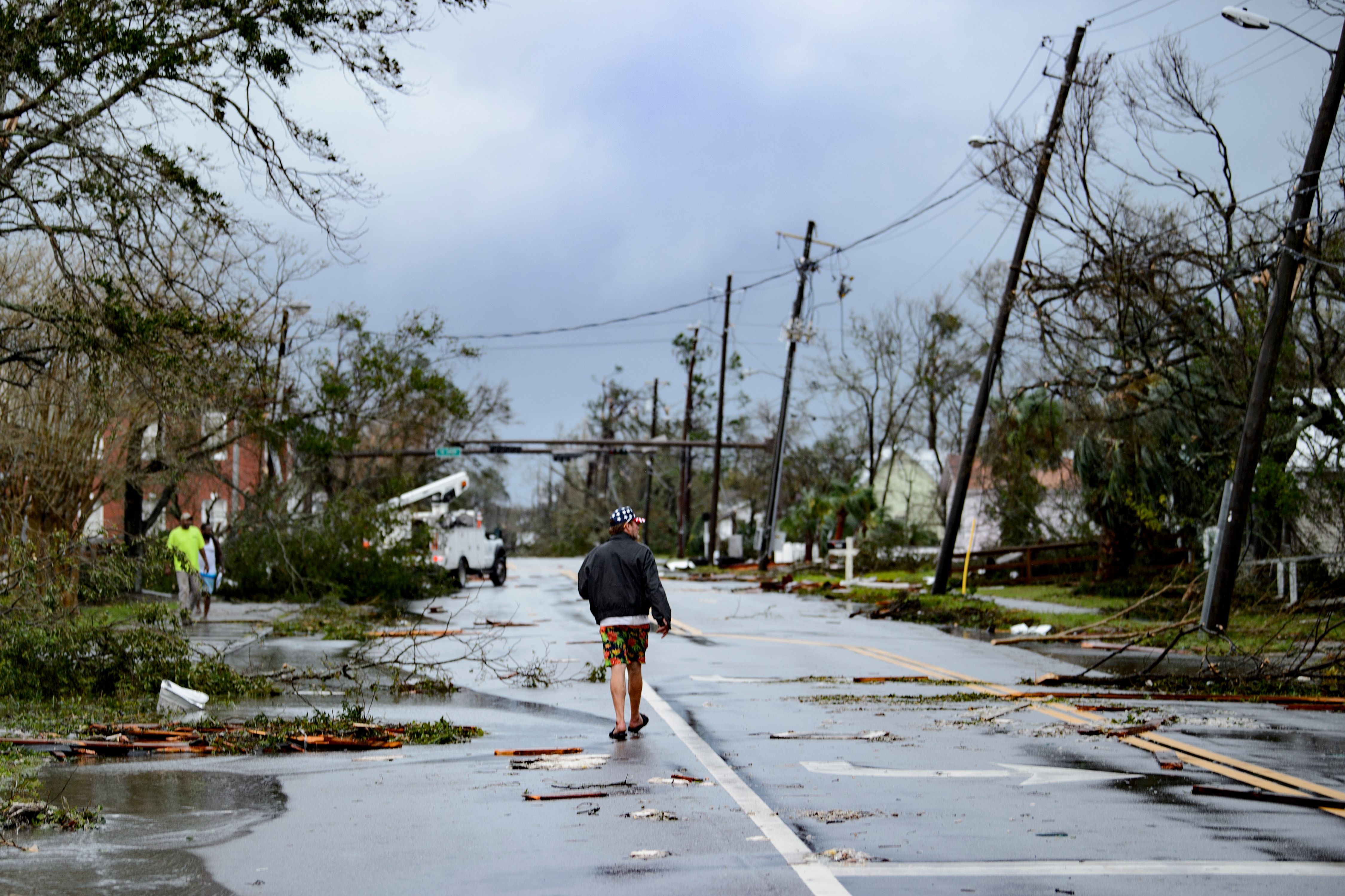 A man walks down the street after Hurricane Michael made landfall on October 10, 2018 in Panama City, Florida. (Credit: BRENDAN SMIALOWSKI/AFP/Getty Images)