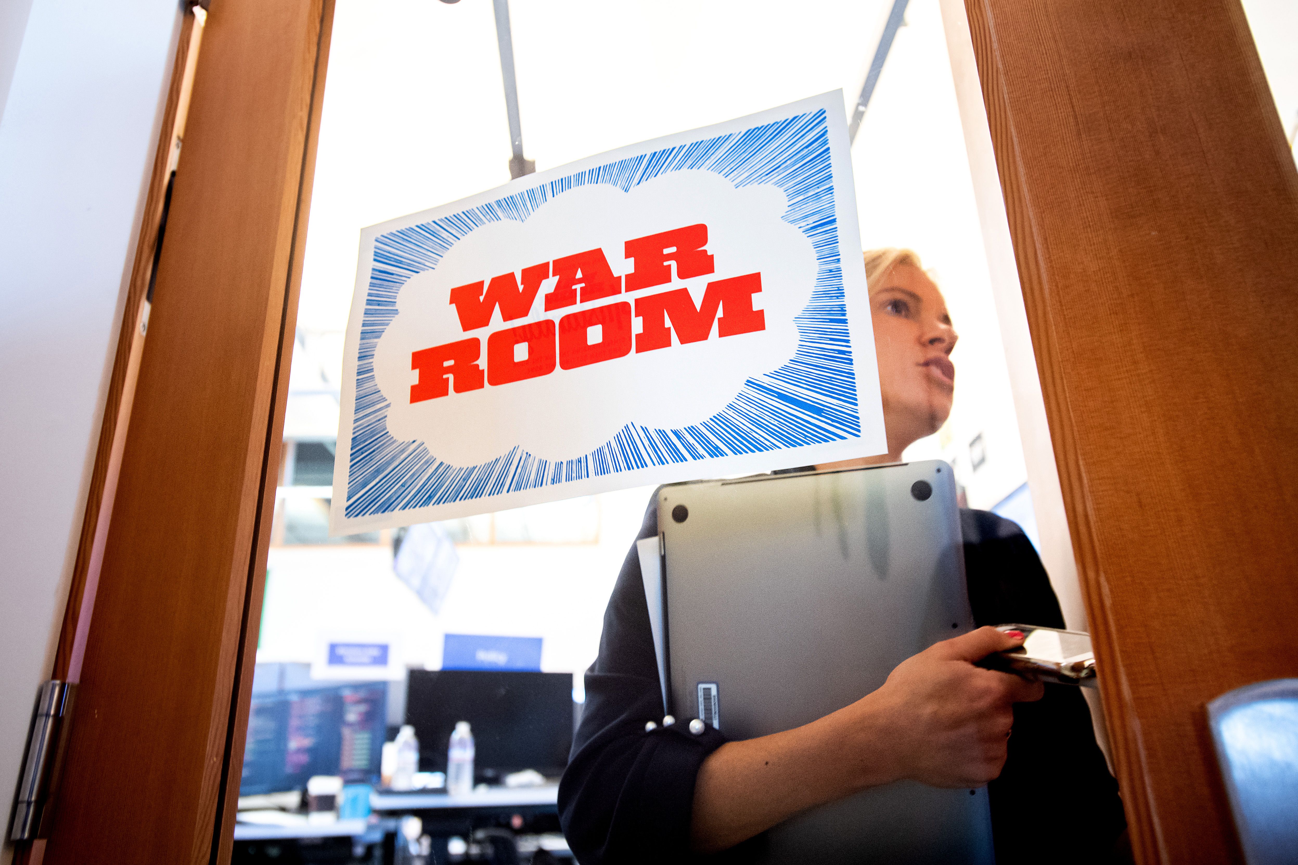 Facebook worker Erin Landers leaves the company's "War Room" during a media demonstration on Oct. 17, 2018 in Menlo Park. (Credit: NOAH BERGER/AFP/Getty Images)