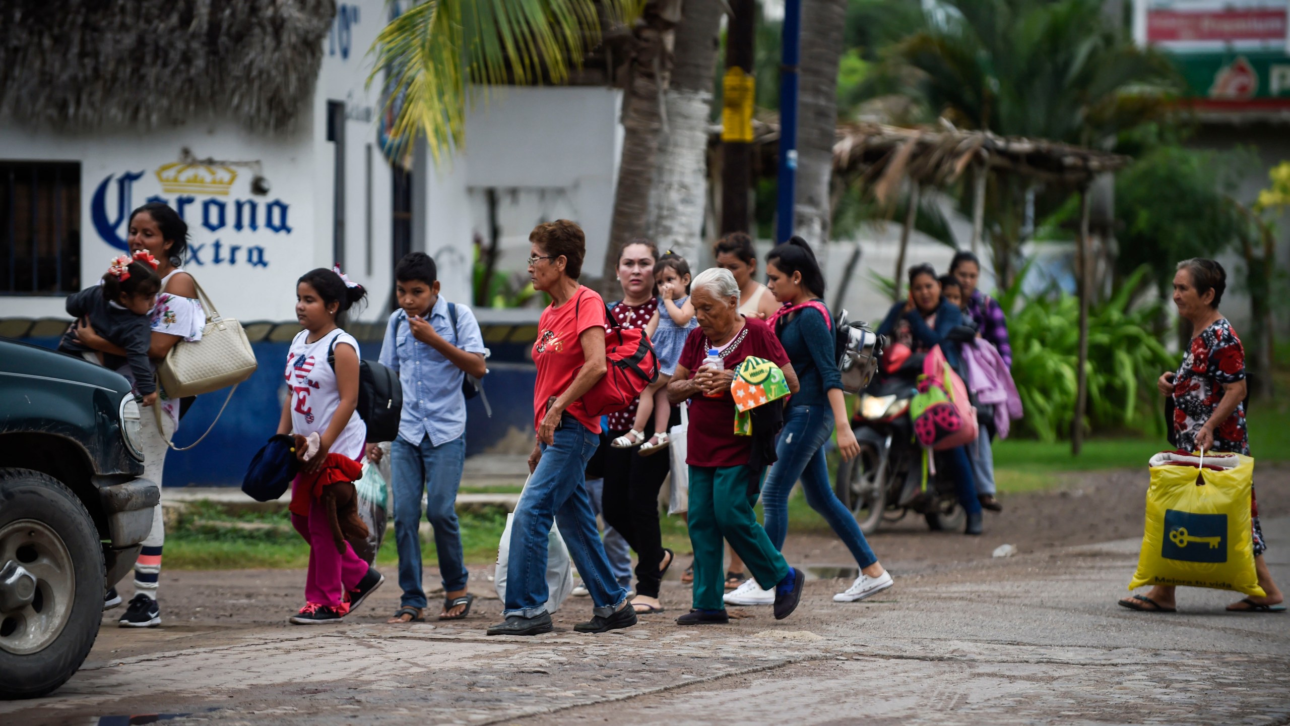 People prepare to be evacuated in Teacapan, Sinaloa state, Mexico, on Oct. 22, 2018, before the arrival of Hurricane Willa. (Credit: Alfredo Estrella / AFP / Getty Images)