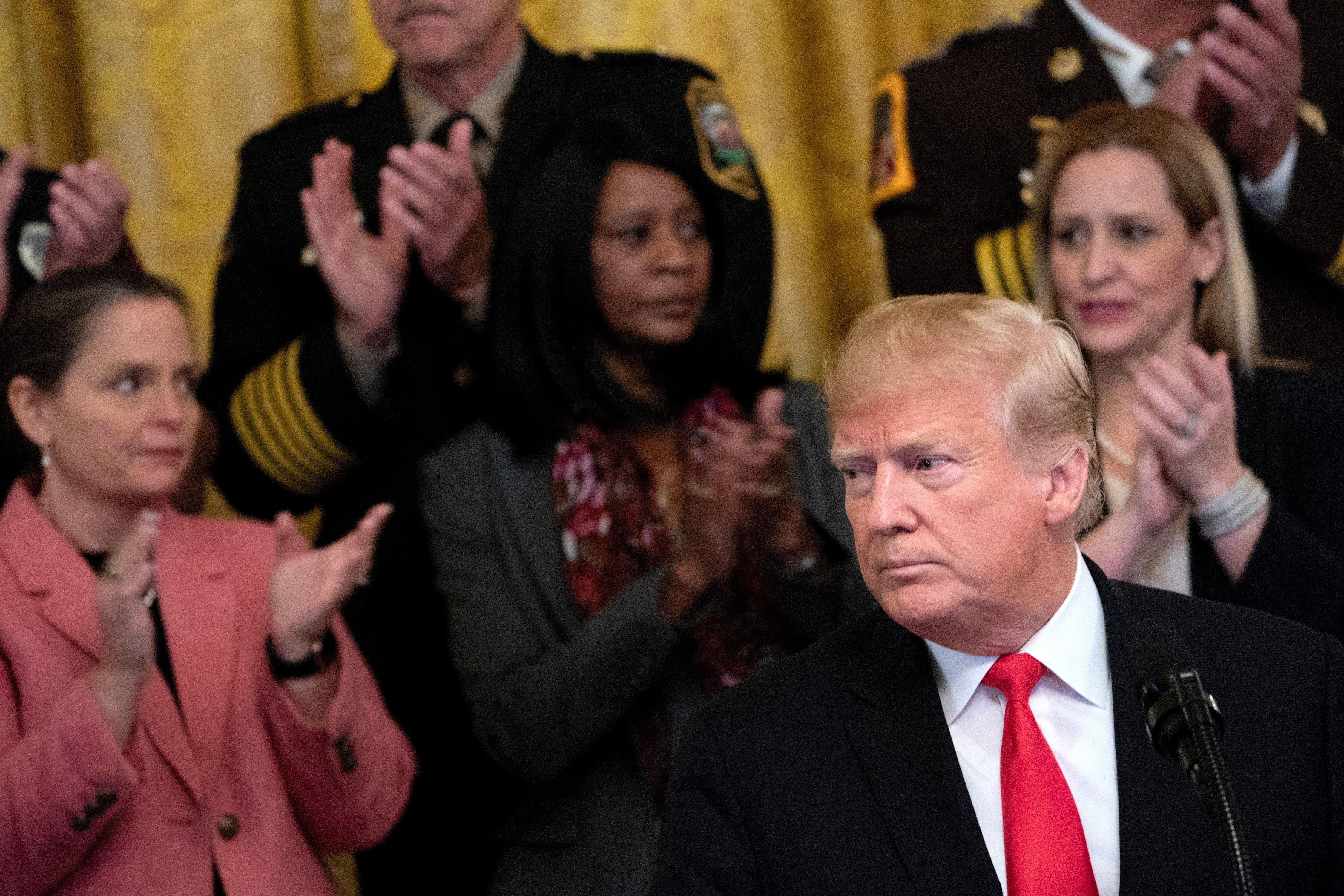 US President Donald Trump listens during an event on a year of progress and action to combat the opioid crisis, in the East Room of the White House on October 24, 2018 in Washington, DC. (Credit: BRENDAN SMIALOWSKI/AFP/Getty Images)