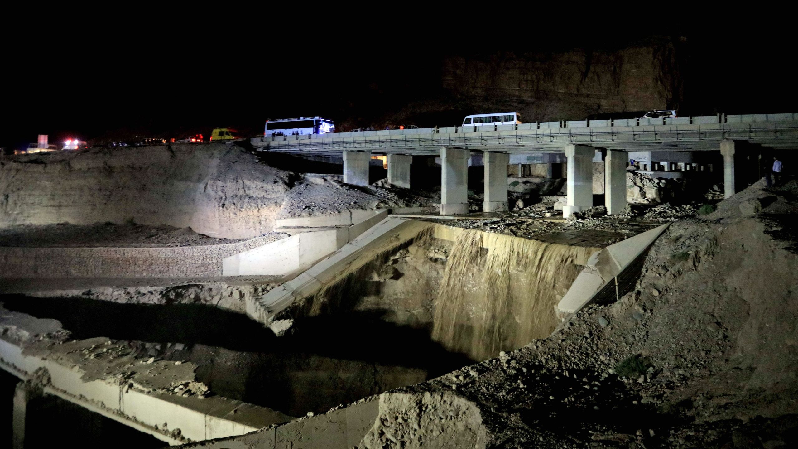 This picture shows the site of a bus accident near the Dead Sea in Jordan on Oct. 25, 2018. Flash floods in Jordan swept away a school bus on October 25, killing at least 17 people, mostly pupils. (Credit: KHALIL MAZRAAWI/AFP/Getty Images)