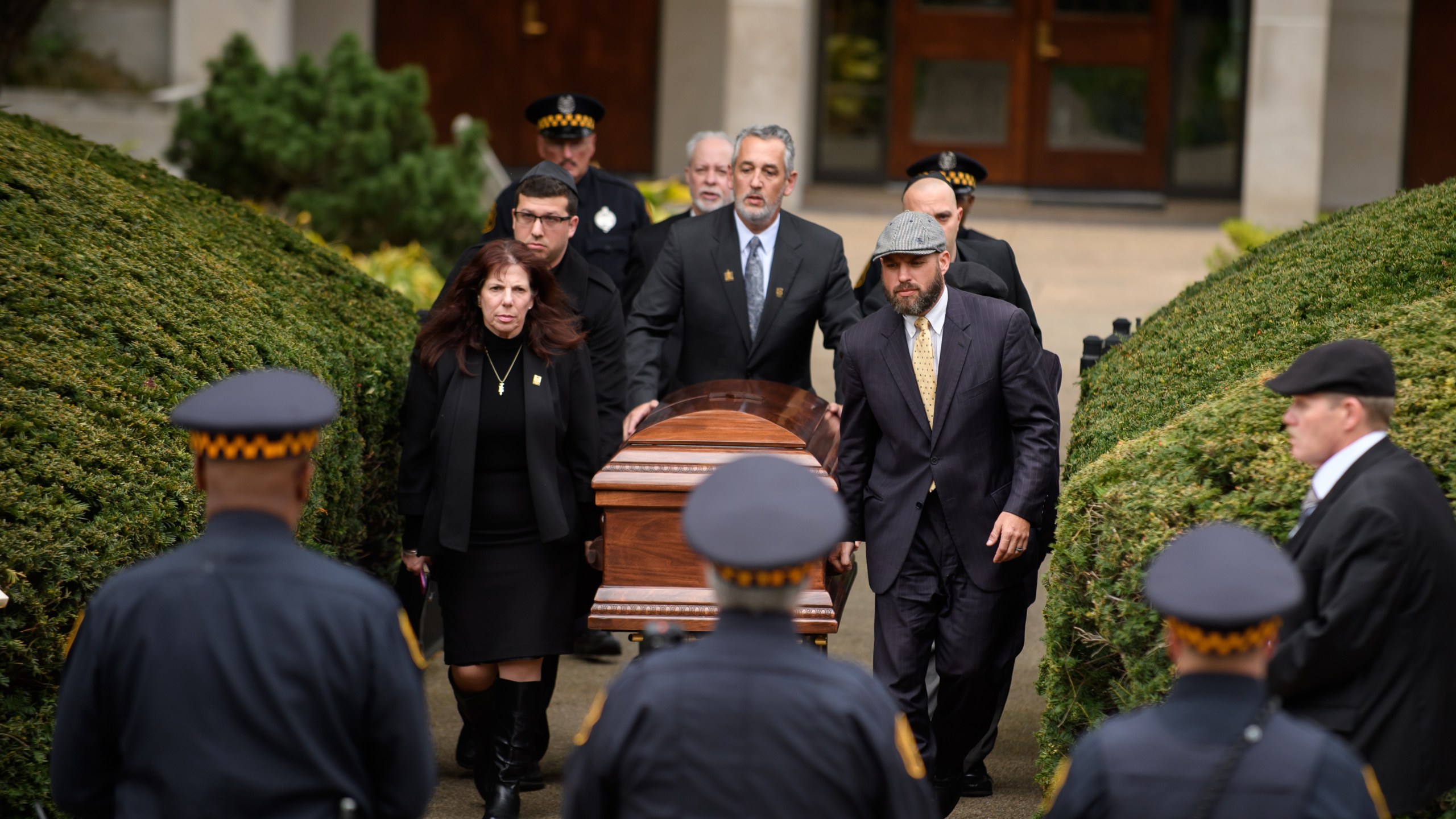 The casket of Irving Younger is led to a hearse outside Rodef Shalom Temple in Pittsburgh following his funeral on Oct. 31, 2018. (Credit: Jeff Swensen / Getty Images)