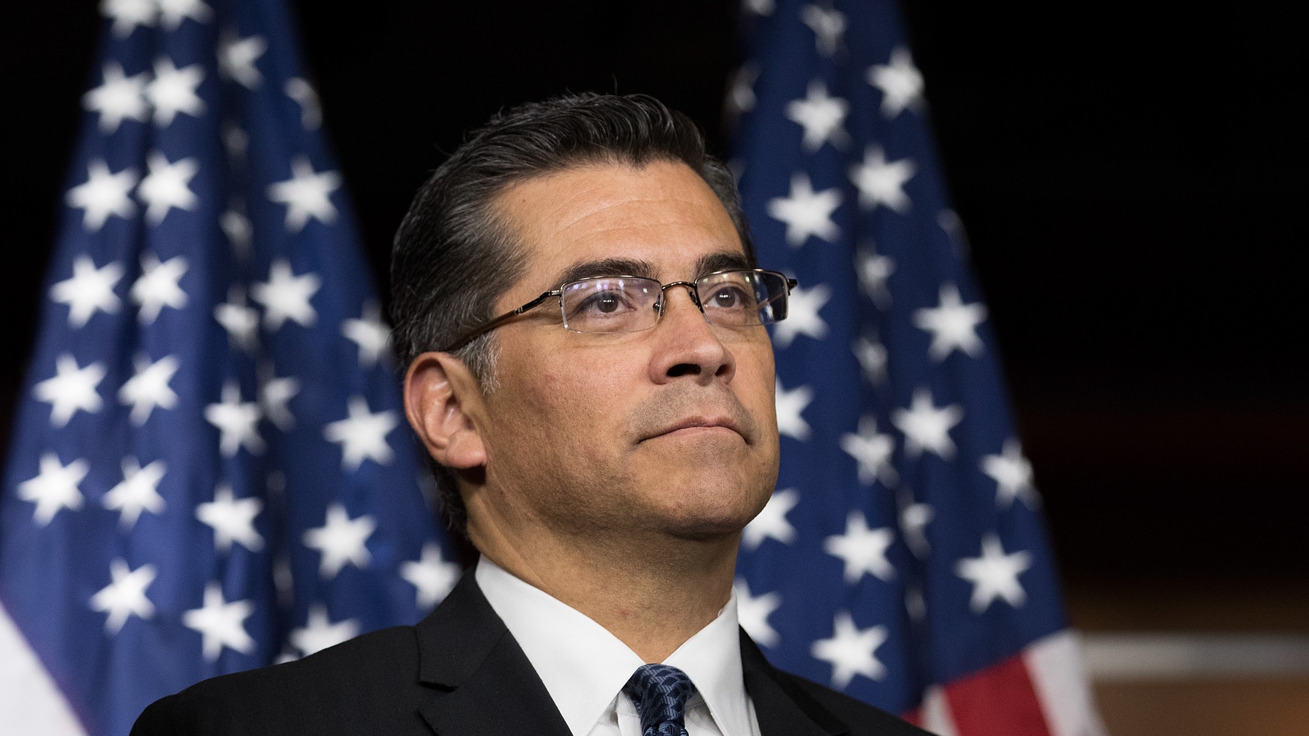 California Attorney General Xavier Becerra listens during a news conference at the U.S. Capitol, May 11, 2016, in Washington, DC. (Credit: Drew Angerer/Getty Images)