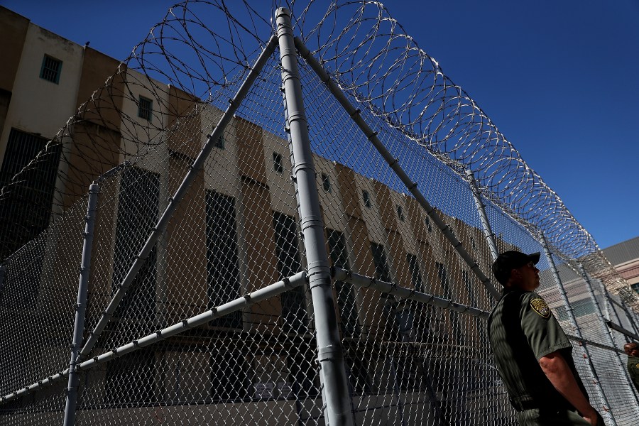 An armed California Department of Corrections and Rehabilitation officer stands guard at San Quentin State Prison's death row on Aug. 15, 2016. (Justin Sullivan / Getty Images)