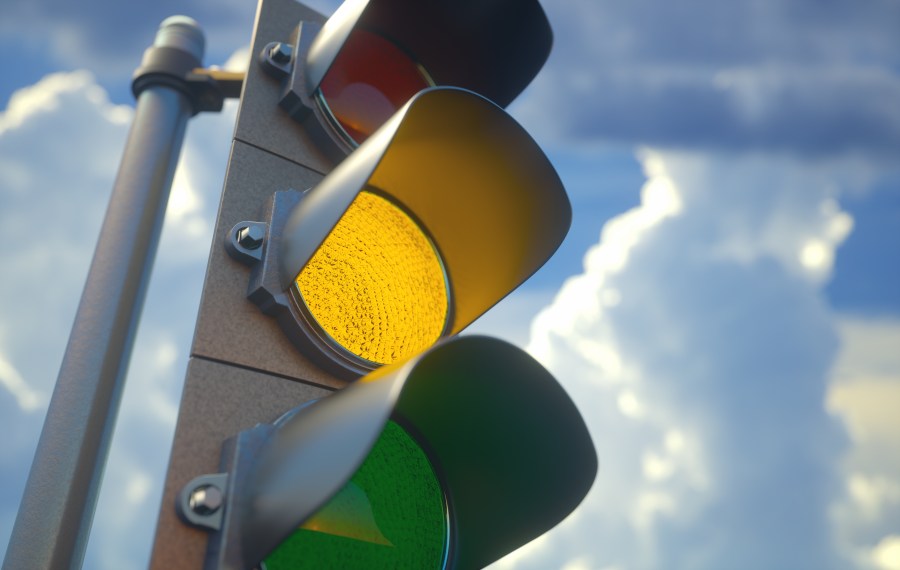 A traffic light with a yellow light on is seen in this file photo. (Credit: iStock/Getty Images Plus)