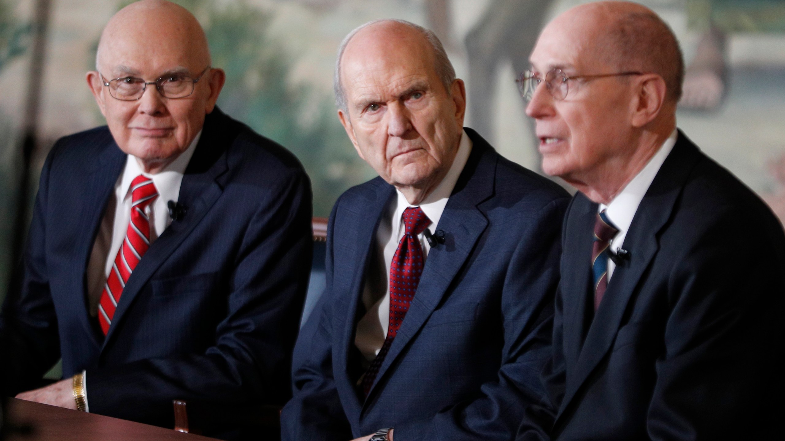 Russell M. Nelson, center, Dallin H. Oaks, left, and Henry B. Eyring, right, answer question from the press after Nelson was announced as the 17th president of the Mormon Church on Jan.16, 2017 in Salt Lake City, Utah. (Credit: George Frey/Getty Images)