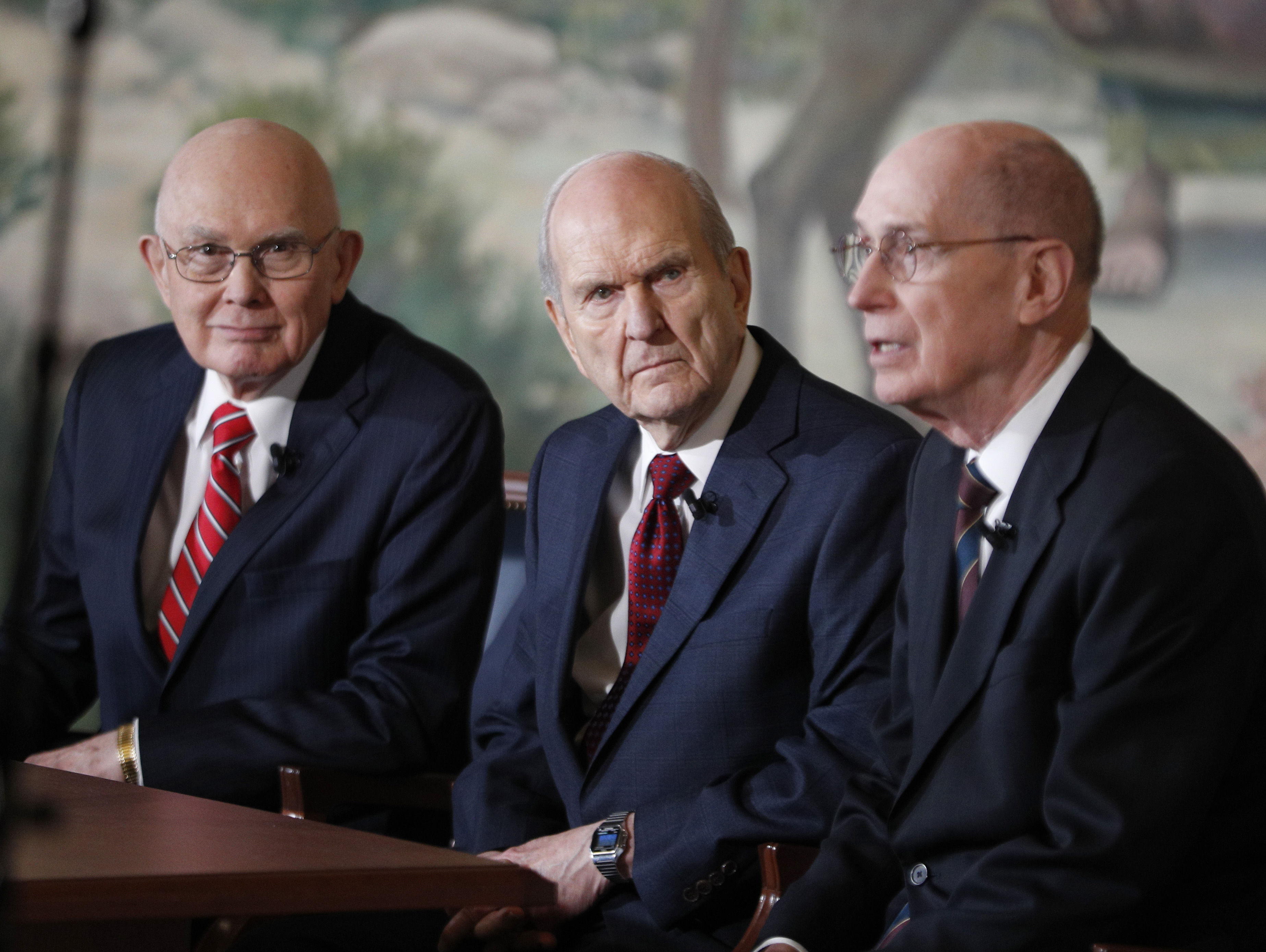 Russell M. Nelson, center, Dallin H. Oaks, left, and Henry B. Eyring, right, answer question from the press after Nelson was announced as the 17th president of the Mormon Church on Jan.16, 2017 in Salt Lake City, Utah. (Credit: George Frey/Getty Images)