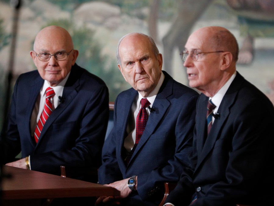 Russell M. Nelson, center, Dallin H. Oaks, left, and Henry B. Eyring, right, answer question from the press after Nelson was announced as the 17th president of the Mormon Church on Jan.16, 2017 in Salt Lake City, Utah. (Credit: George Frey/Getty Images)