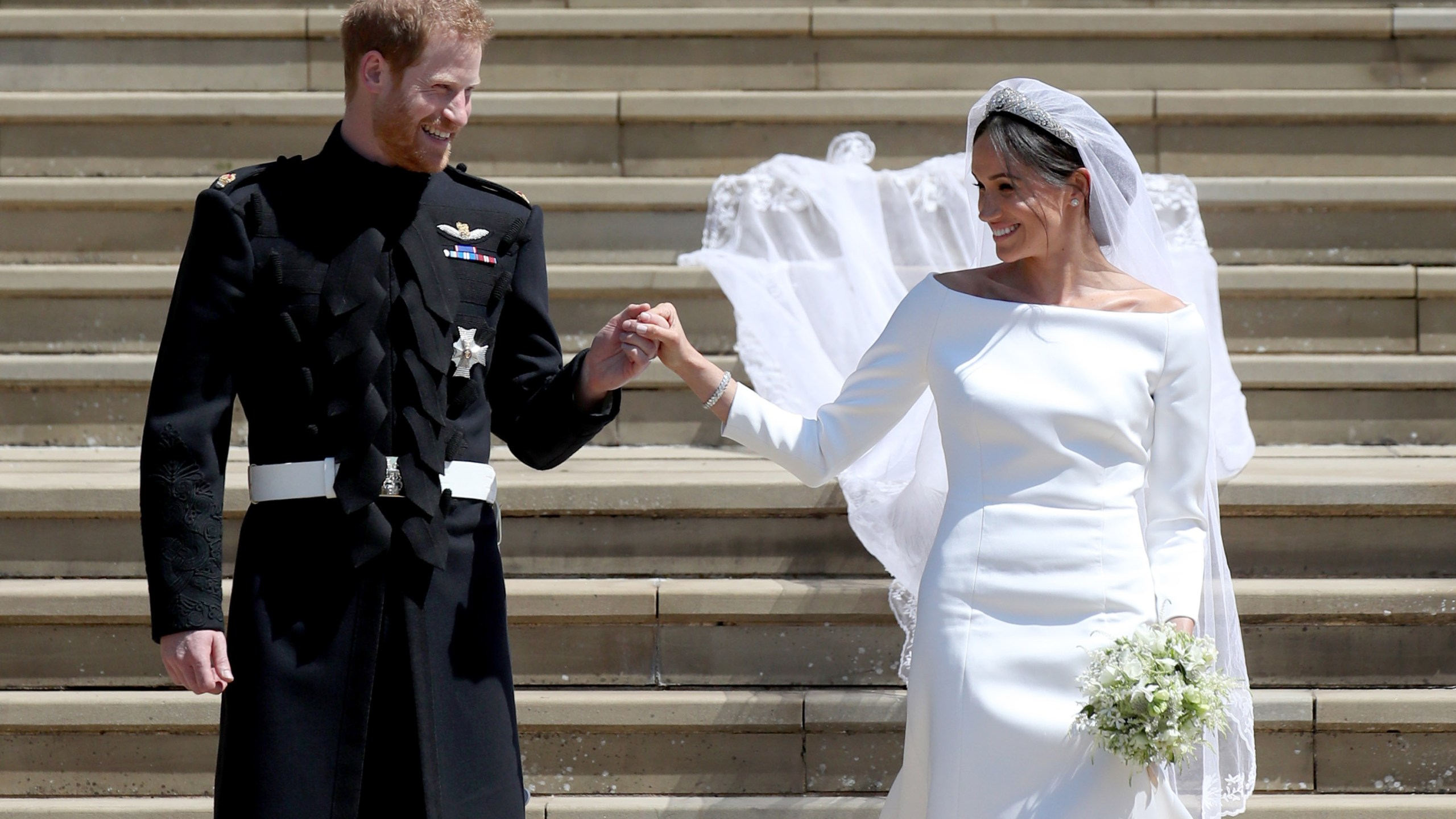 Prince Harry, Duke of Sussex and the Duchess of Sussex depart after their wedding ceremonyat St George's Chapel at Windsor Castle on May 19, 2018 in Windsor, England. (Credit: Jane Barlow - WPA Pool/Getty Images)