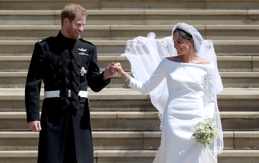 Prince Harry, Duke of Sussex and the Duchess of Sussex depart after their wedding ceremonyat St George's Chapel at Windsor Castle on May 19, 2018 in Windsor, England. (Credit: Jane Barlow - WPA Pool/Getty Images)