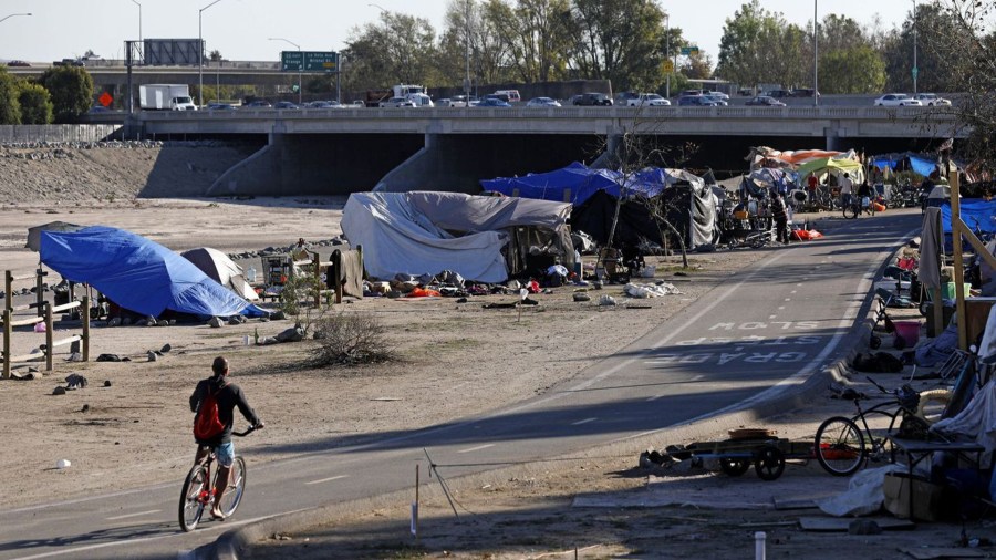 A homeless encampment along the Santa Ana River in Anaheim. Earlier this year, a federal judge ordered the encampment to be cleared. (Credit: Gary Coronado / Los Angeles Times)