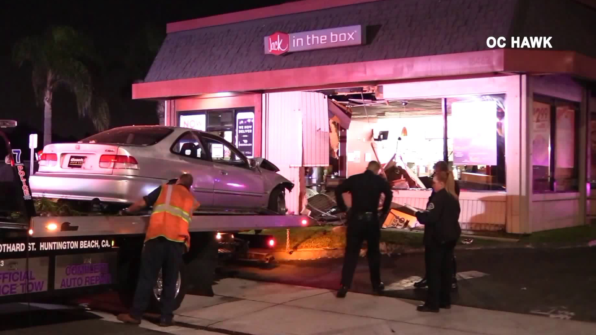 A car is removed from a Jack in the Box in Huntington Beach after crashing on Oct. 12, 2018. (Credit: OC Hawk)