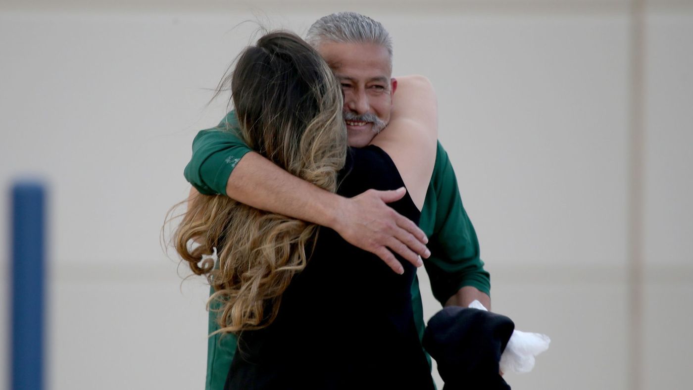 Romulo Avelica Gonzalez, 49, spent six months at an immigration detention facility in Adelanto investigated by federal officials for harsh, sometimes dangerous conditions. Here, he is seen embracing his daughter in 2017 after being released. (Credit: Luis Sinco / Los Angeles Times)