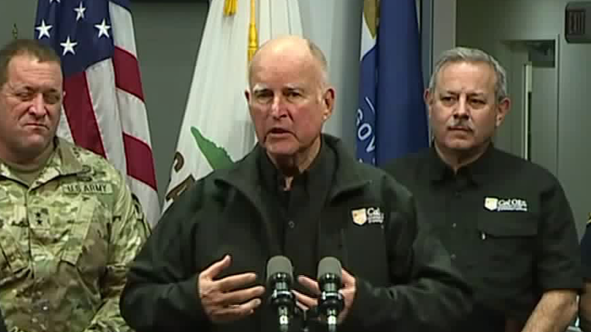 Gov. Jerry Brown speaks to reporters during a news conference in which he offered updates on a set of devastating wildfires across the state on Nov. 11, 2018, speaking alongside emergency officials. (Credit: KTXL)