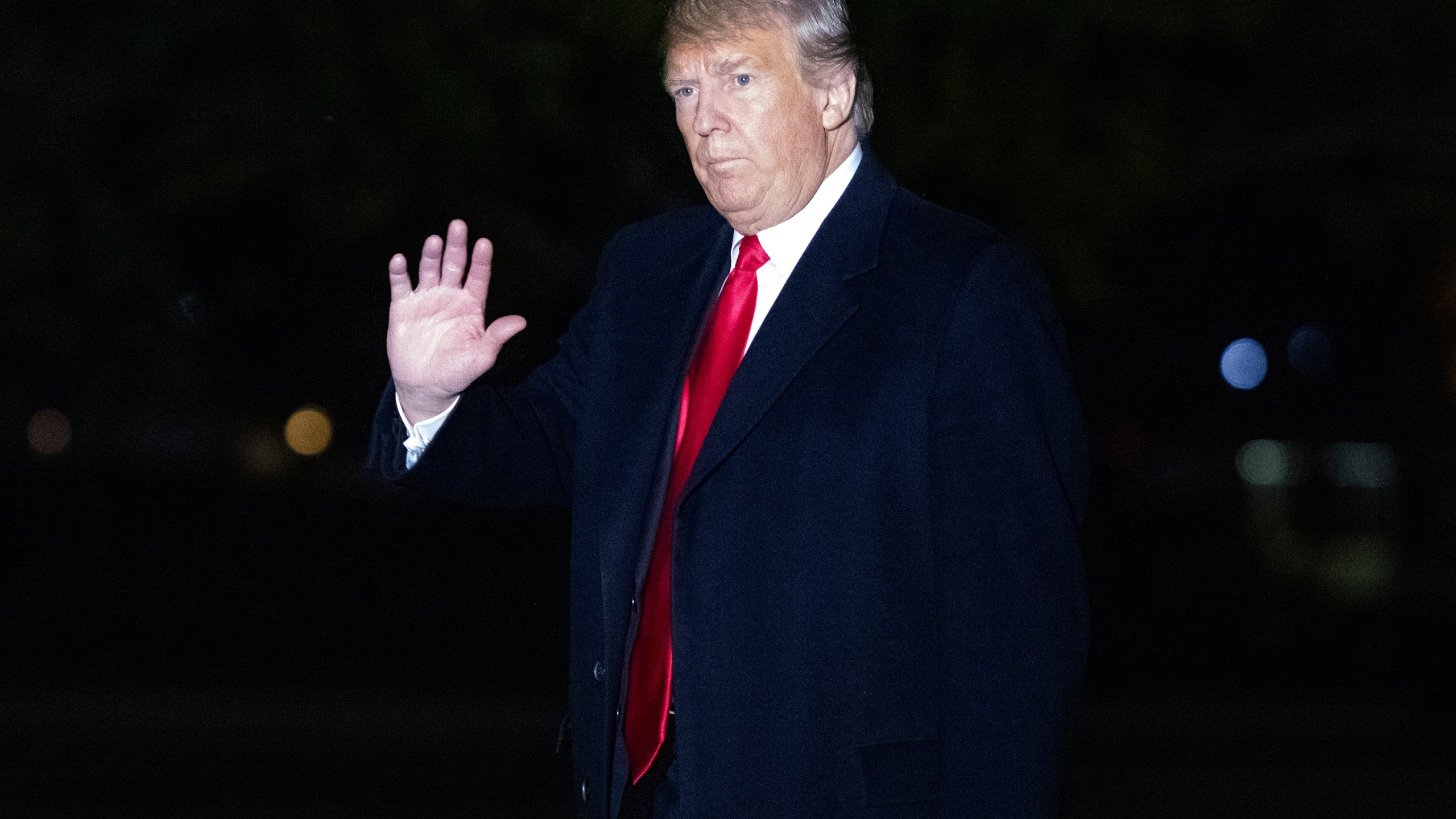 Donald Trump waves to the press pool as he arrives on the South Lawn of the White House after delivering remarks at a Make America Great Again Rally in Estero, Florida on Oct. 31, 2018. (Credit: Ron Sachs-Pool/Getty Images)