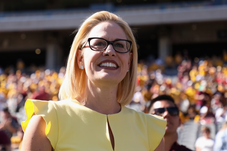 Democratic U.S. Senate candidate Rep. Kyrsten Sinema participates in the pregame coin toss before the game between the Utah Utes and the Arizona State Sun Devils at Sun Devil Stadium on Nov. 3, 2018, in Tempe, Arizona. (Credit: Christian Petersen/Getty Images)