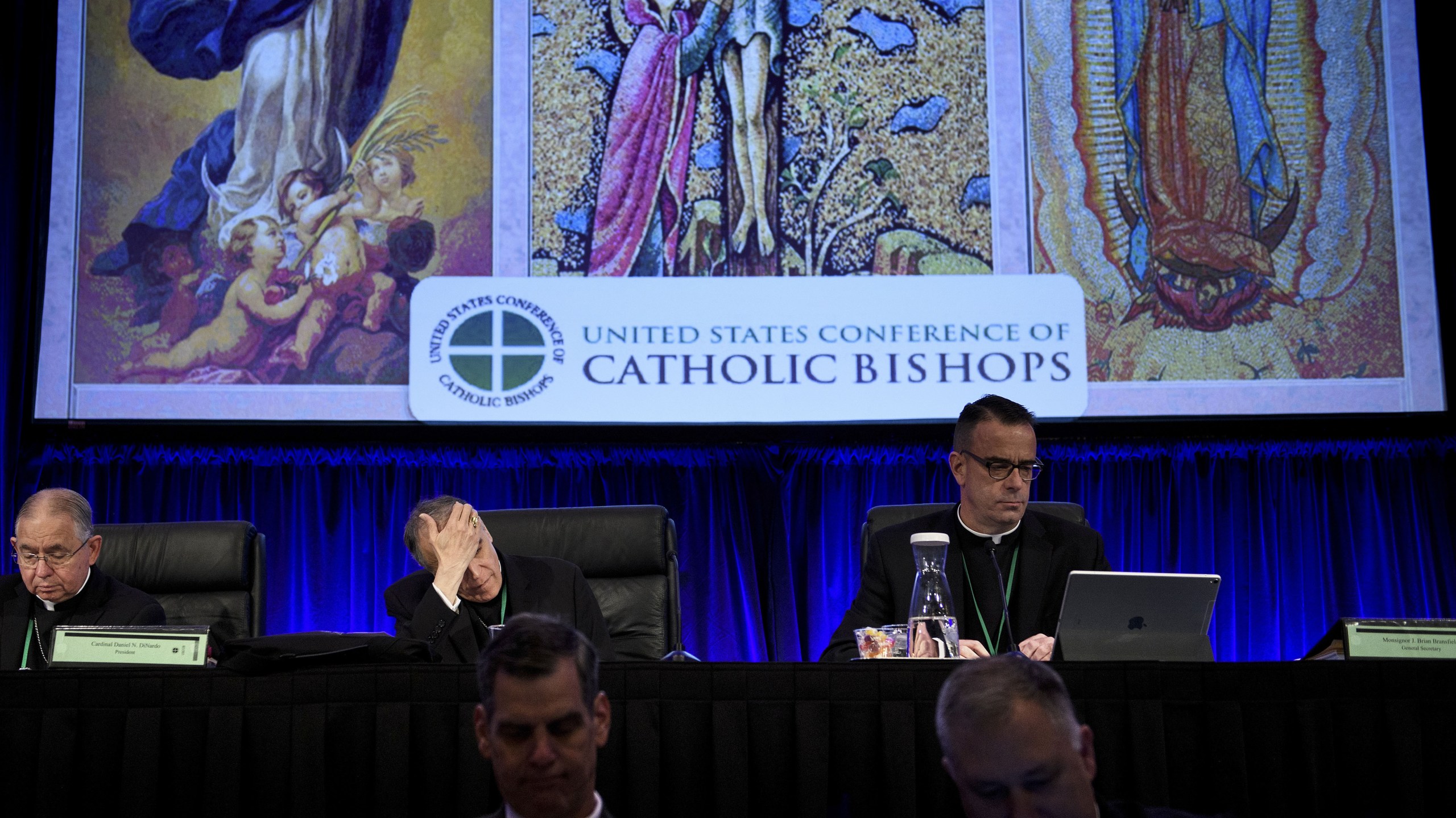 Reverend Jose Gomez (Top L), Archbishop of Los Angeles and Vice President of the USCCB General Assembly, Cardinal Daniel DiNardo (Top C), President of the USCCB General Assembly, and others wait for an opening session during the annual US Conference of Catholic Bishops November 12, 2018 in Baltimore, Maryland. (Credit: BRENDAN SMIALOWSKI/AFP/Getty Images)